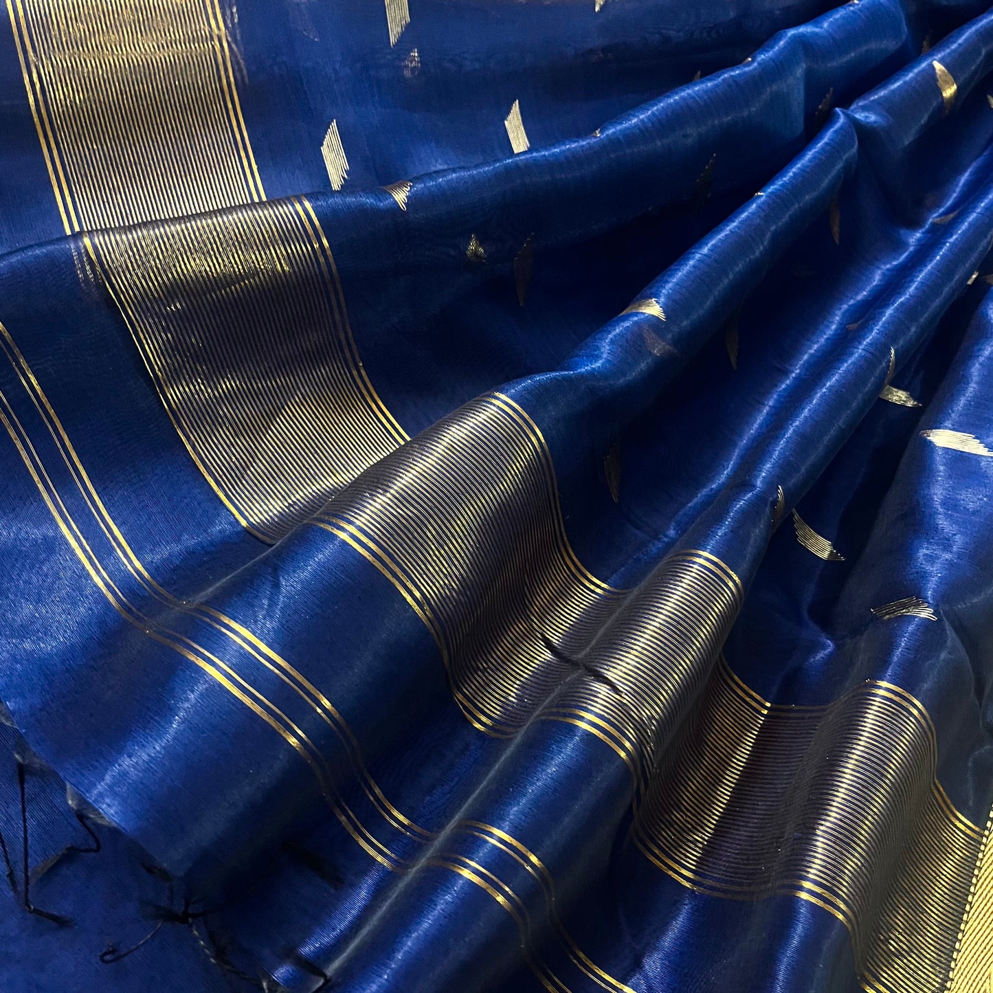Dark blue Maheshwari tissue silk saree with zari bootis all over