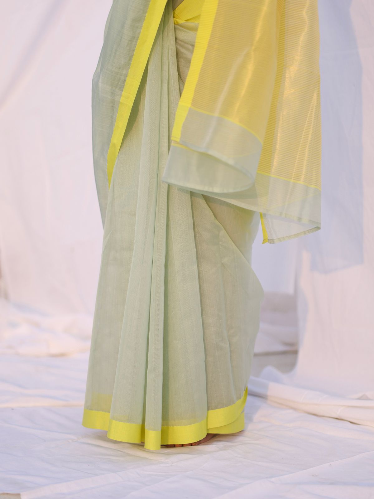 Sage and lemon Chanderi saree with zari lines on pallu