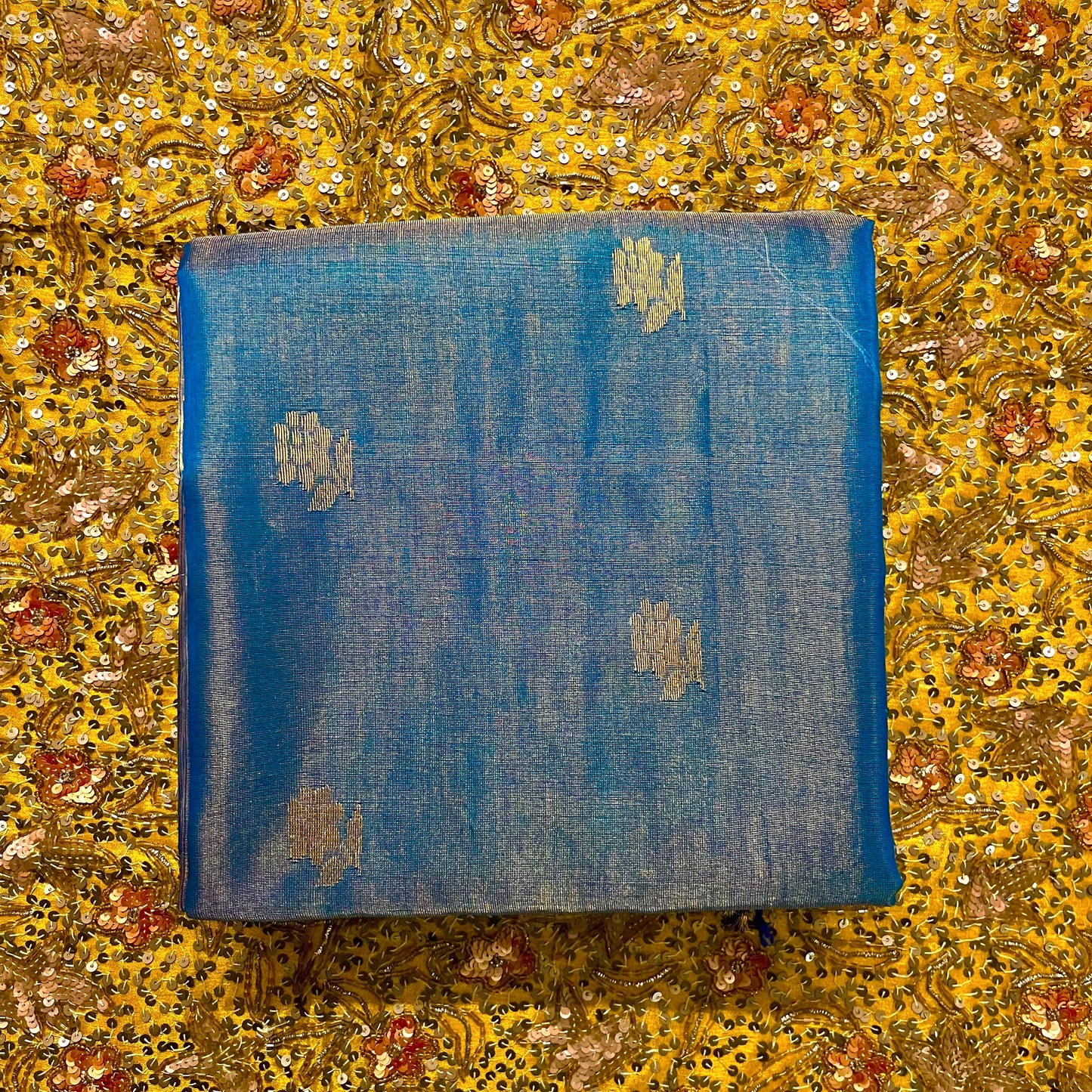 Peacock blue maheshwari tissue silk saree with flower motifs all over