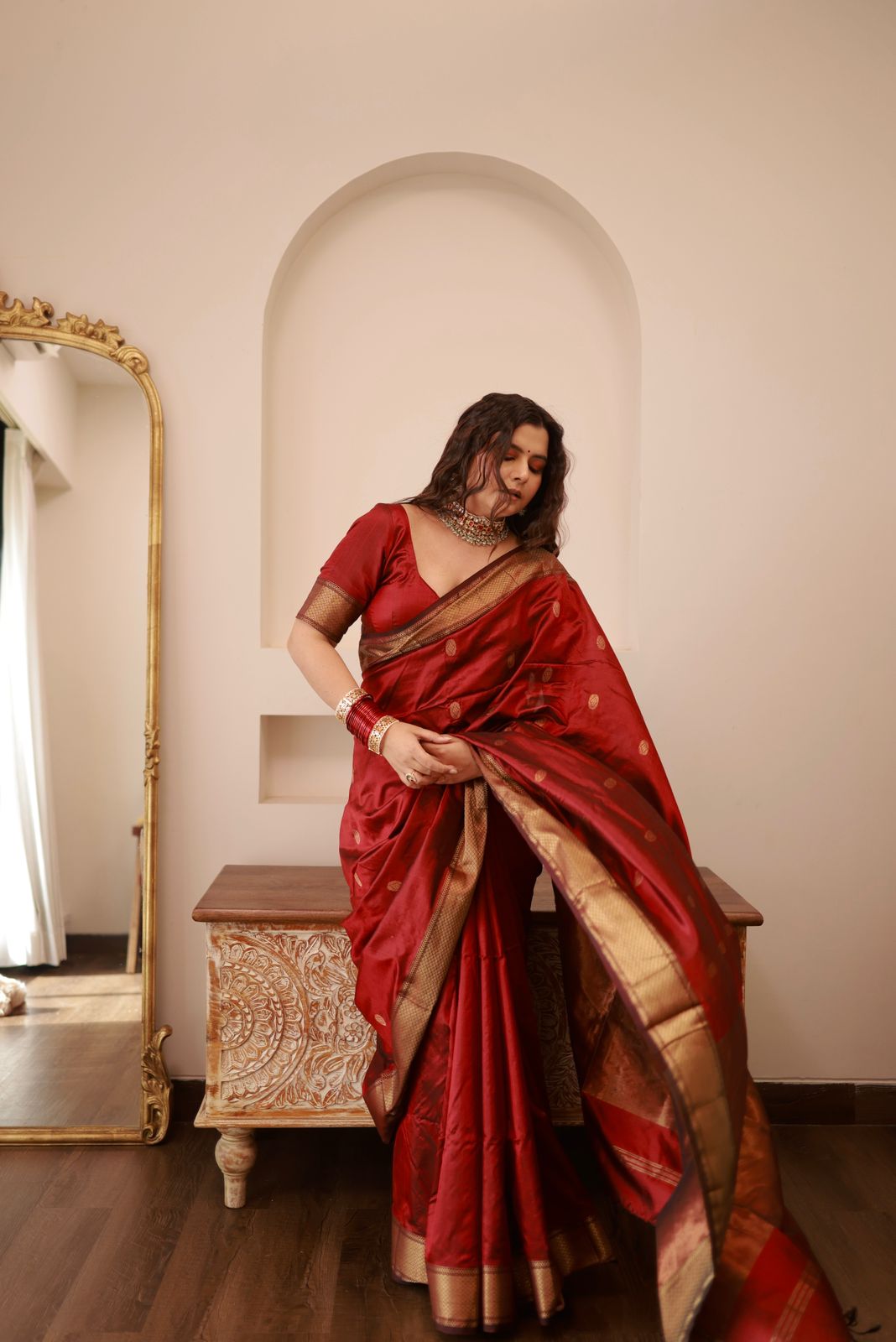 Deep maroon Maheshwari silk saree with zari bootis all over