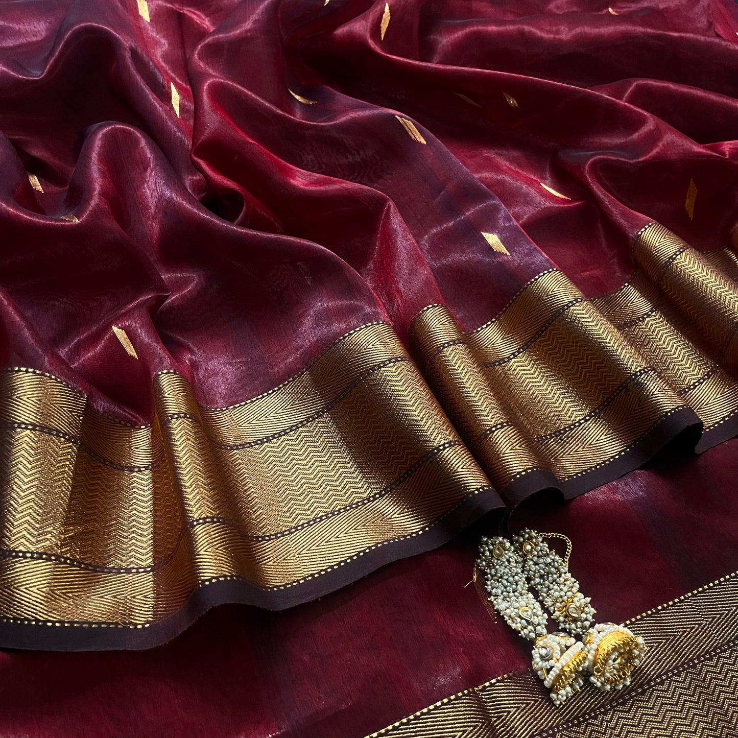 Mahogany Maheshwari tissue silk saree with zari bootis all over