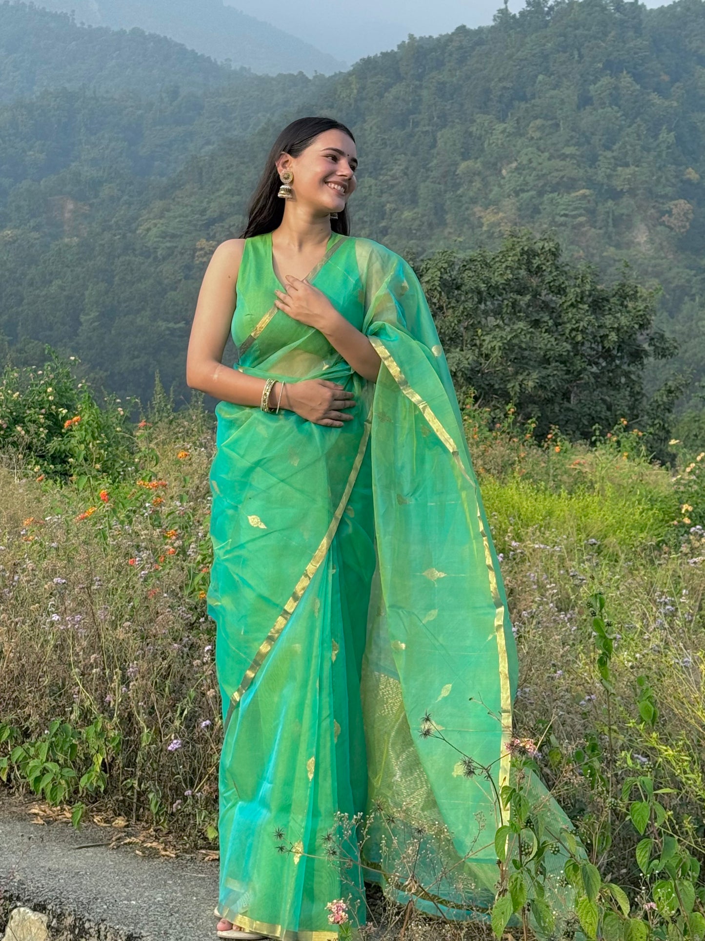 Green and gold dual tone chanderi organza silk saree with jhumka motifs all over