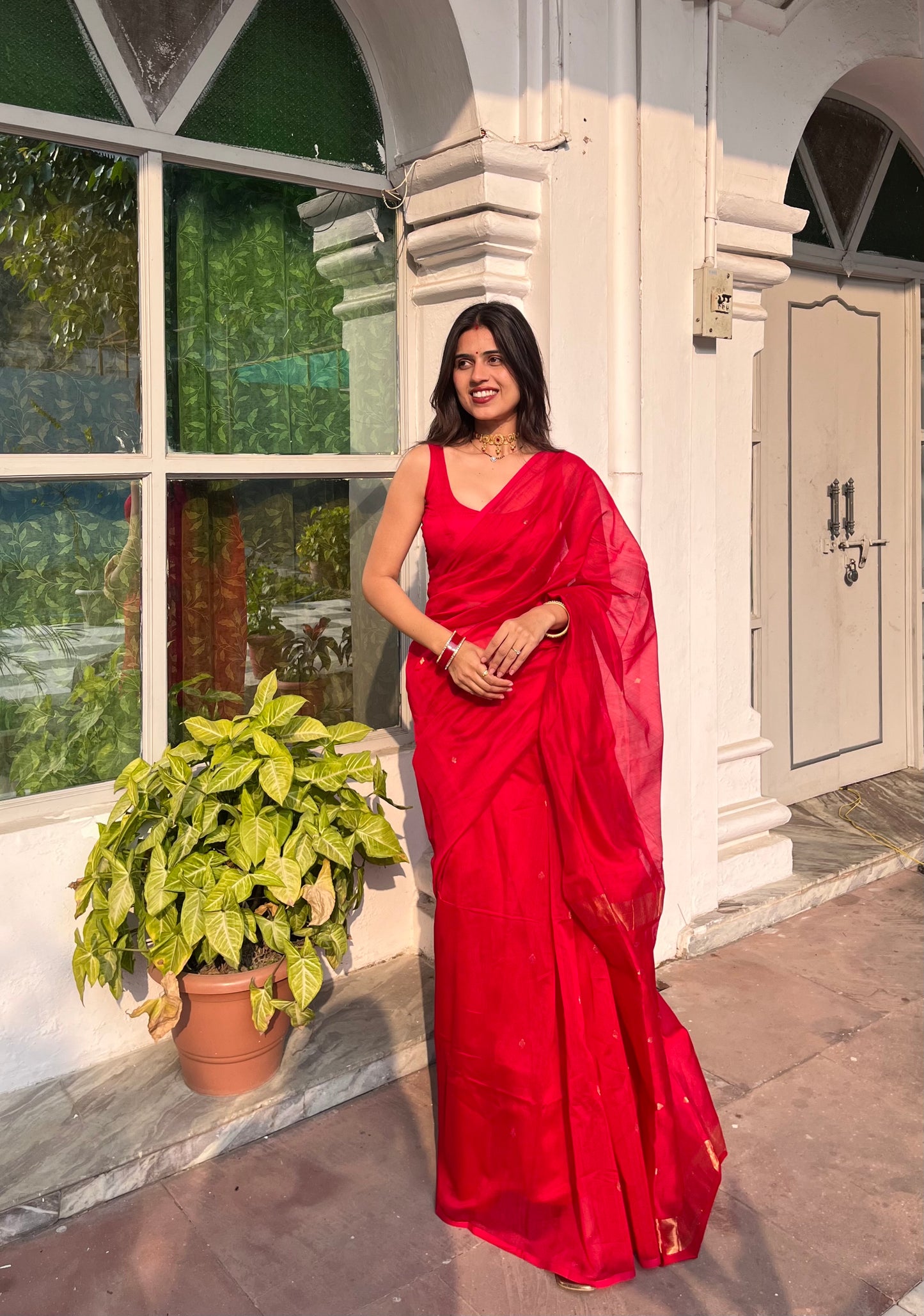Deep red maheshwari saree with zari bootis all over