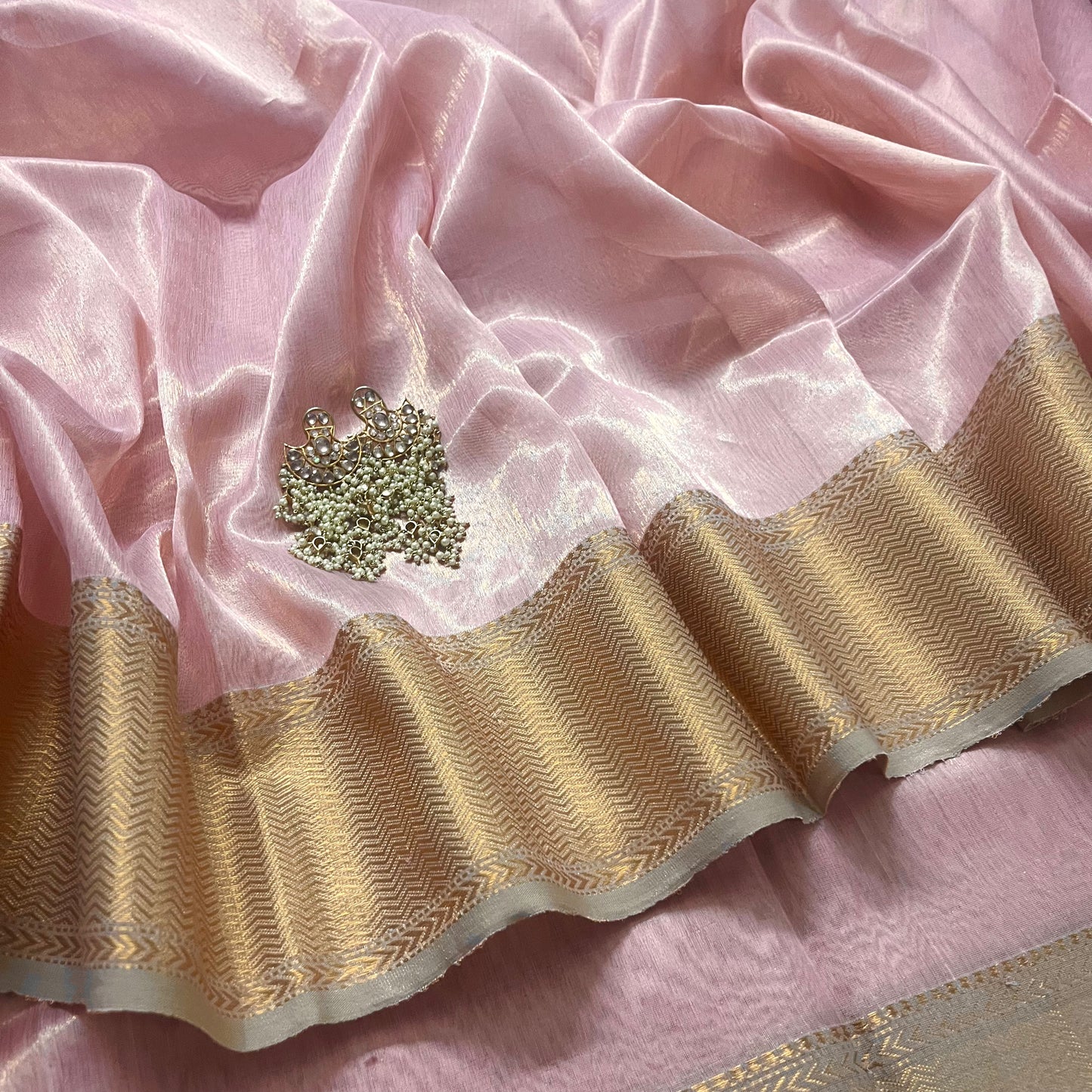 Peachish pink maheshwari tissue silk saree with zari pattern on pallu