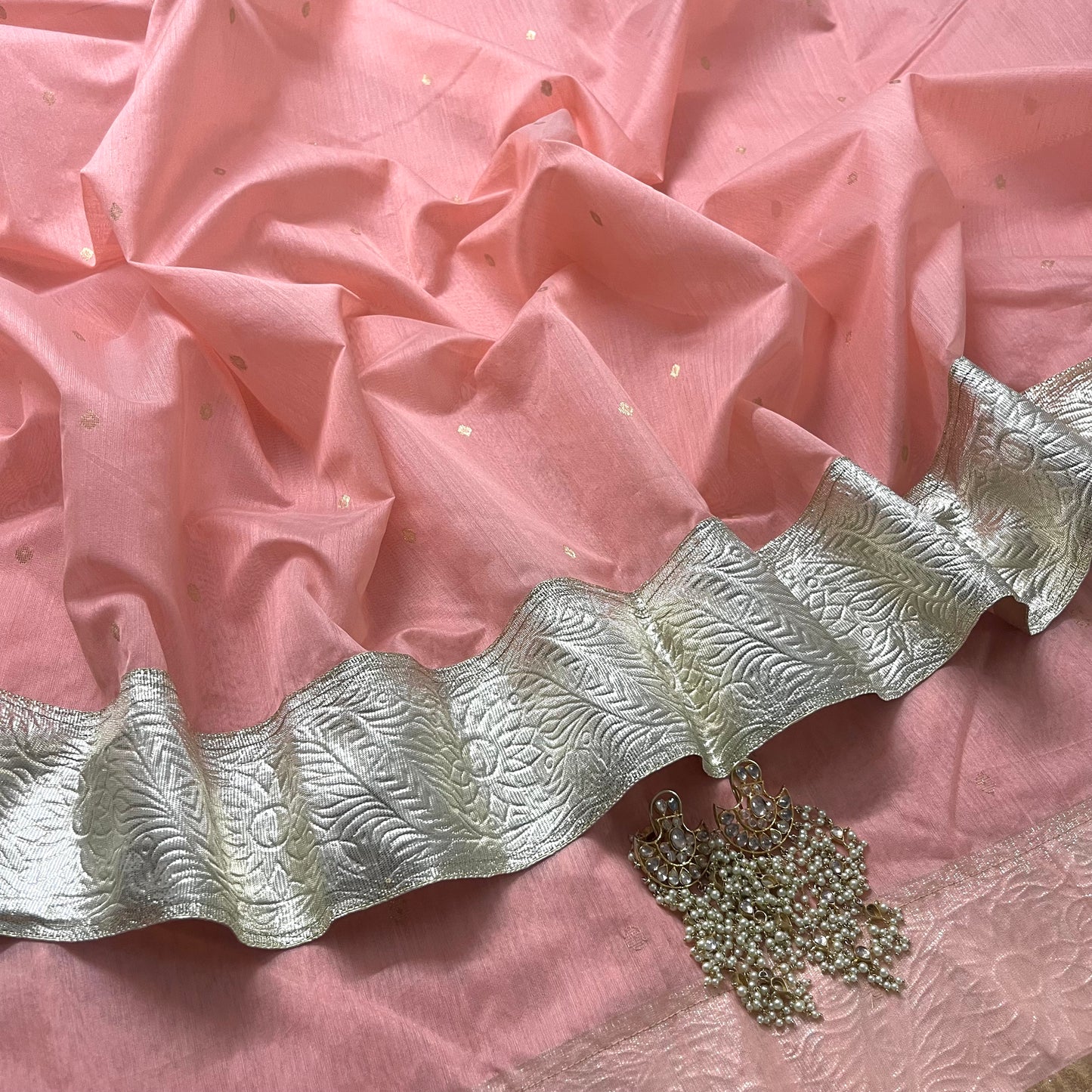 Peachish pink chanderi saree with zari bootis all over