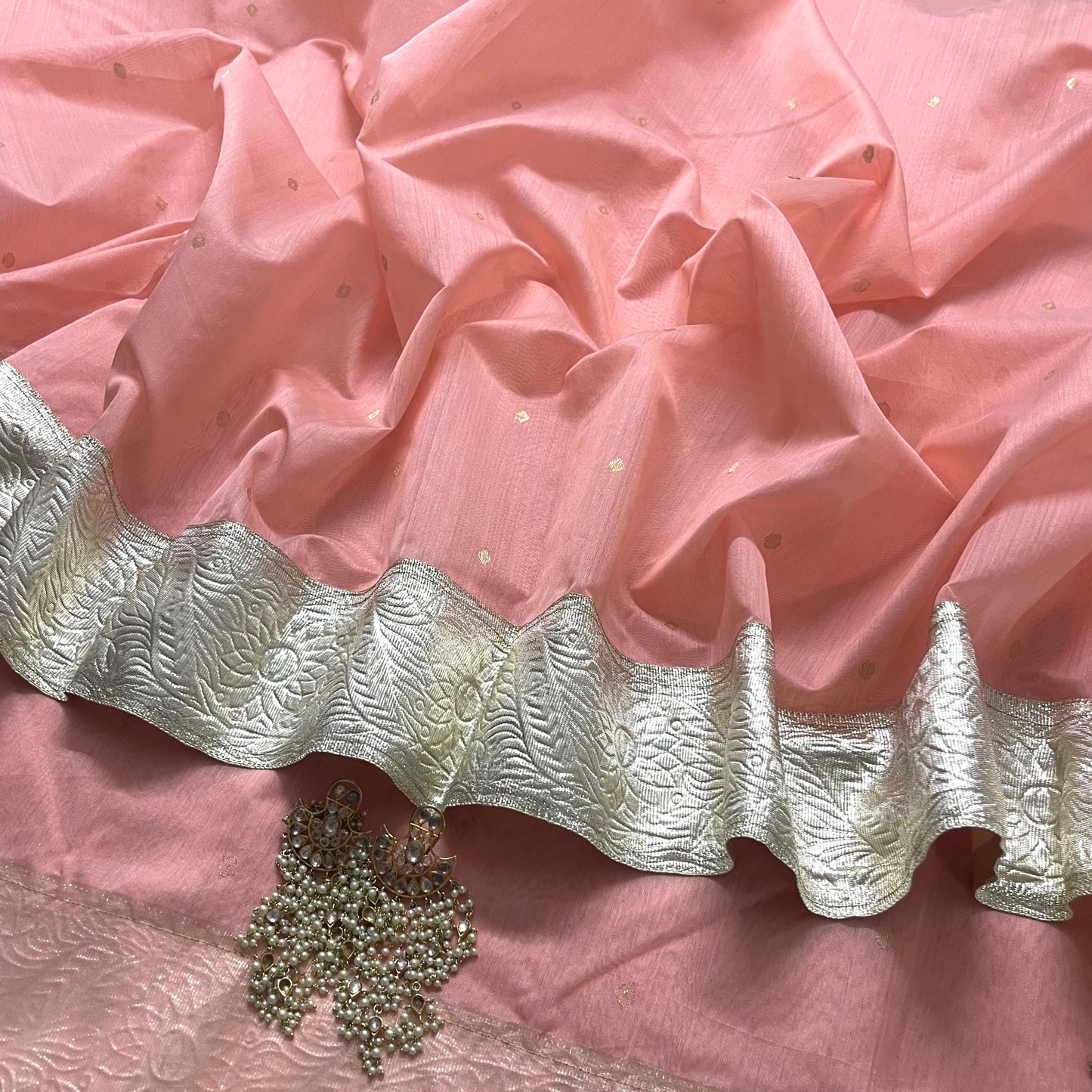 Peachish pink chanderi saree with zari bootis all over