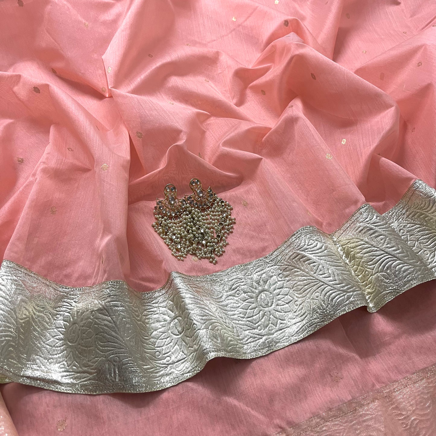 Peachish pink chanderi saree with zari bootis all over