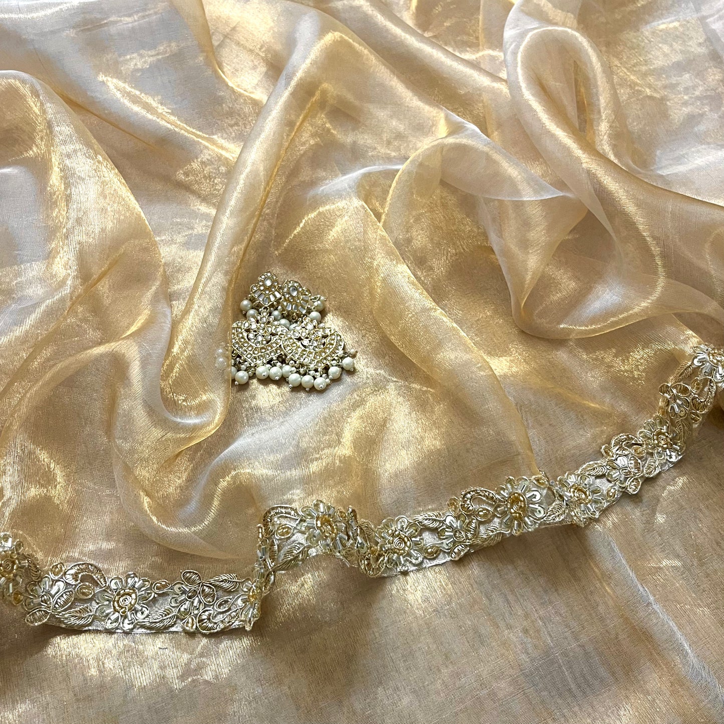 Molten gold chanderi tissue silk saree with intricate work border