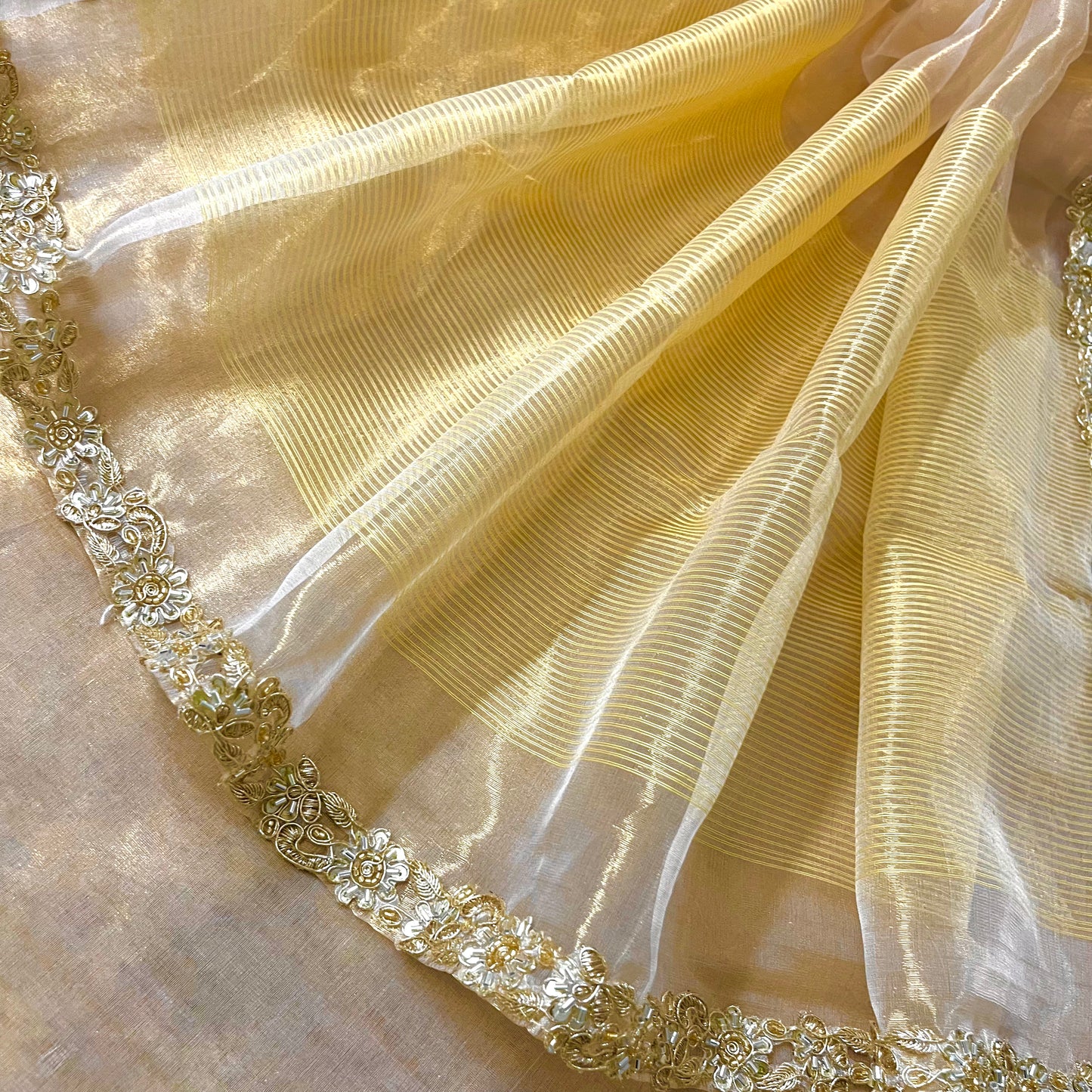Molten gold chanderi tissue silk saree with intricate work border