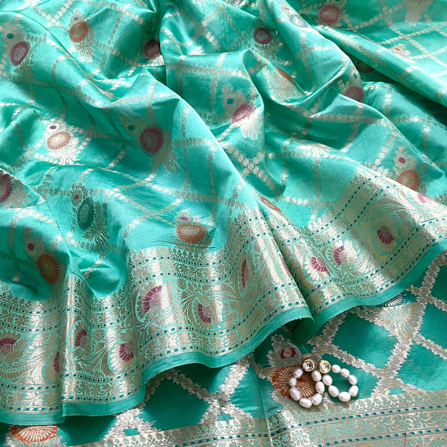 Sea green banarasi silk saree with zari jaal work all over