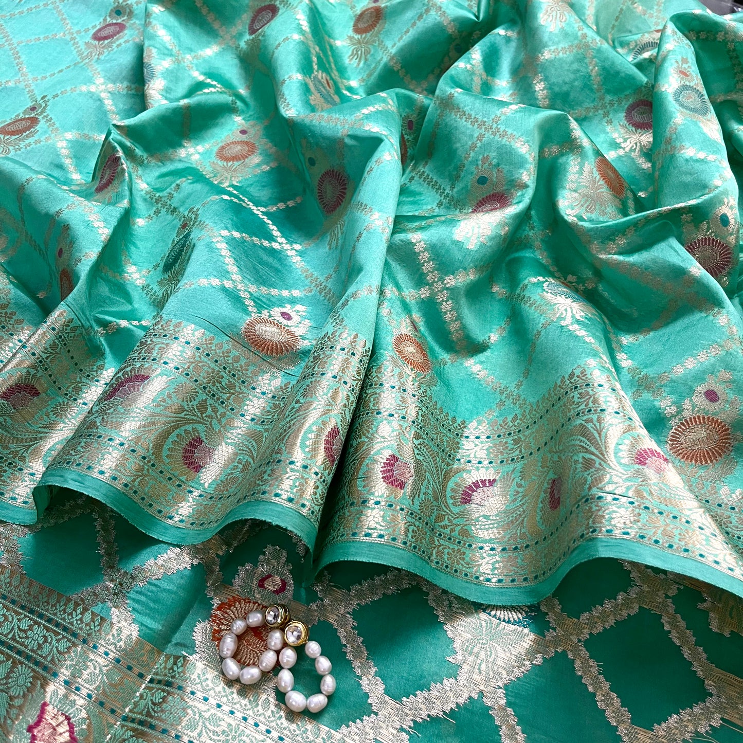 Sea green banarasi silk saree with zari jaal work all over