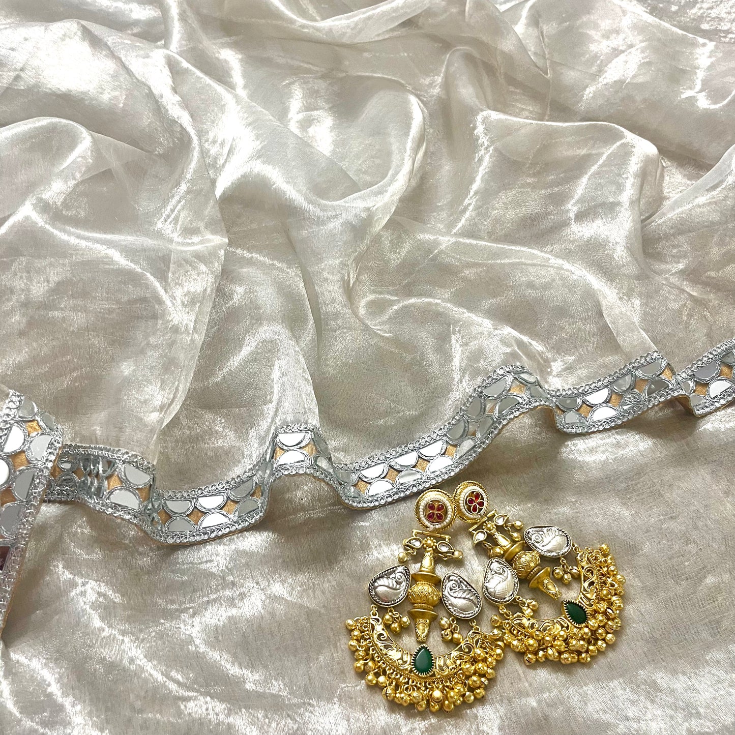 Molten silver and gold chanderi tissue silk saree with mirror work border