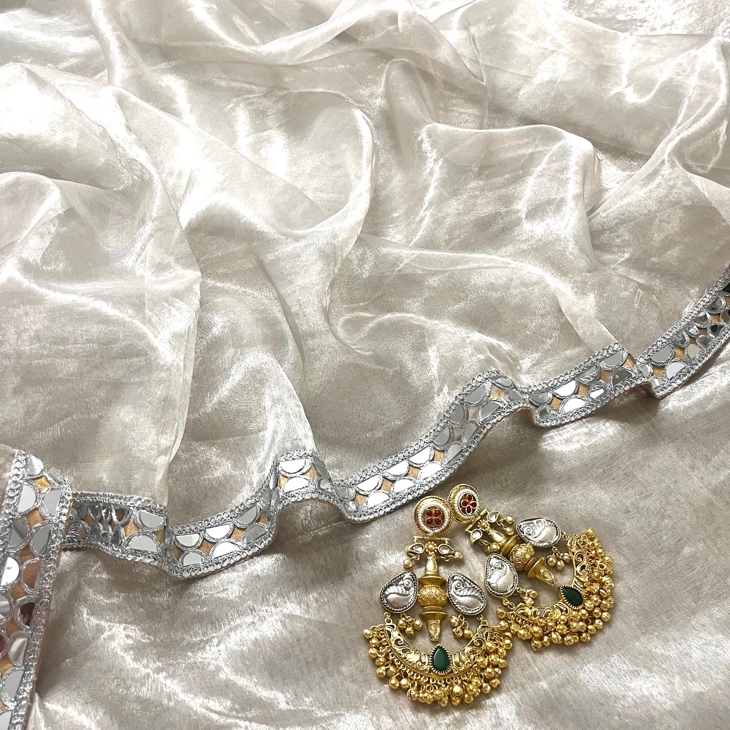 Molten silver and gold chanderi tissue silk saree with mirror work border