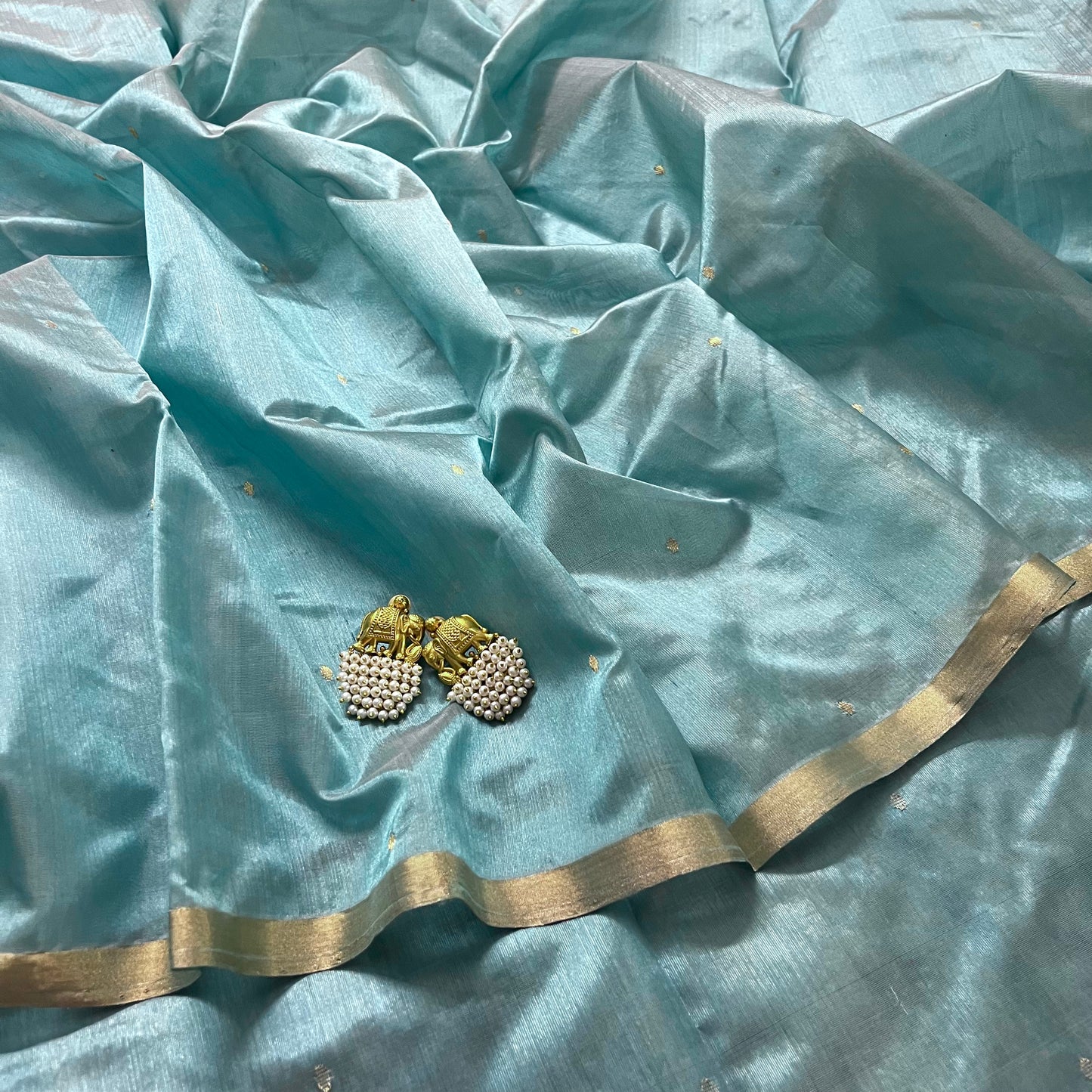 Baby blue chanderi silk saree with zari bootis all over