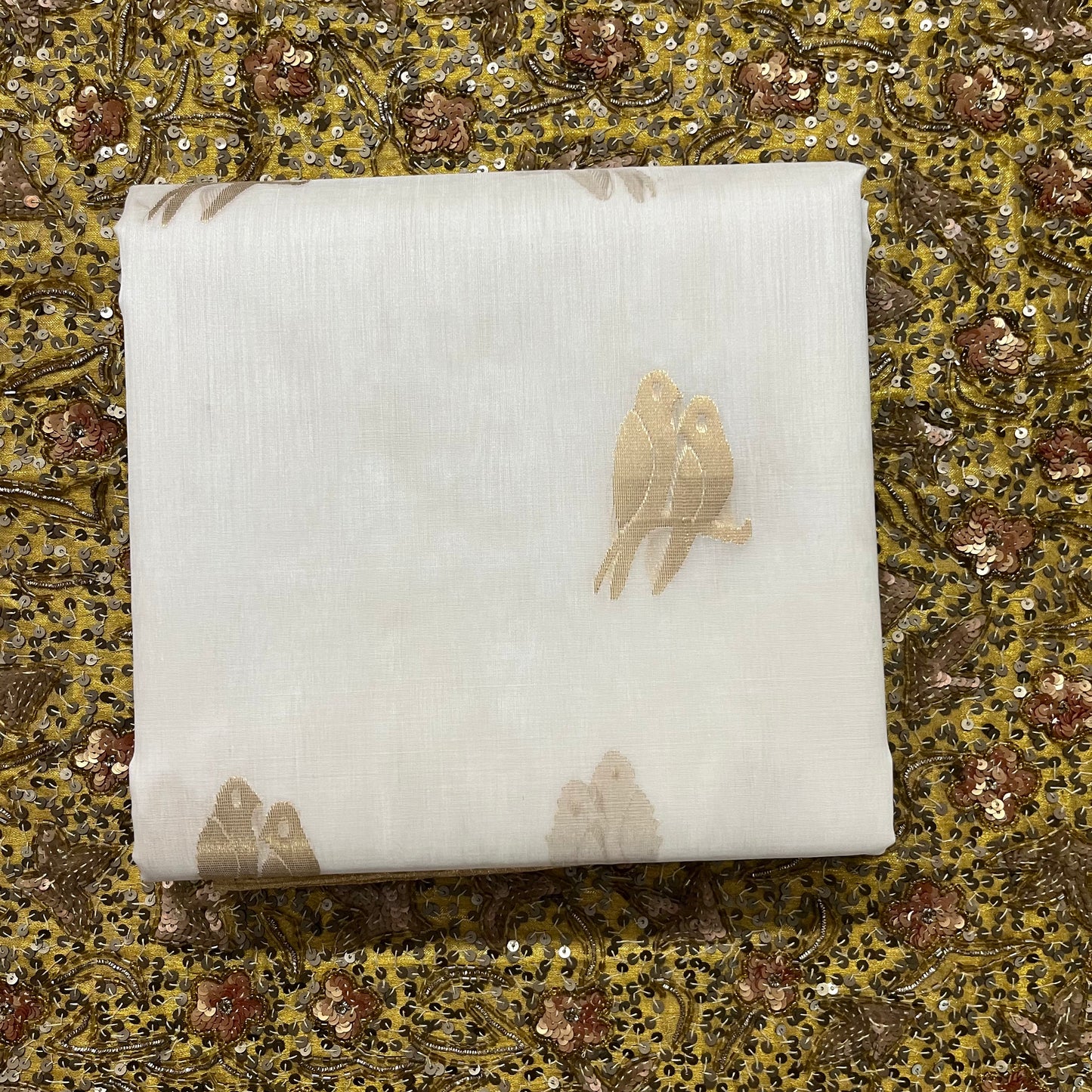 Off white and gold chanderi organza silk saree with bird motifs all over