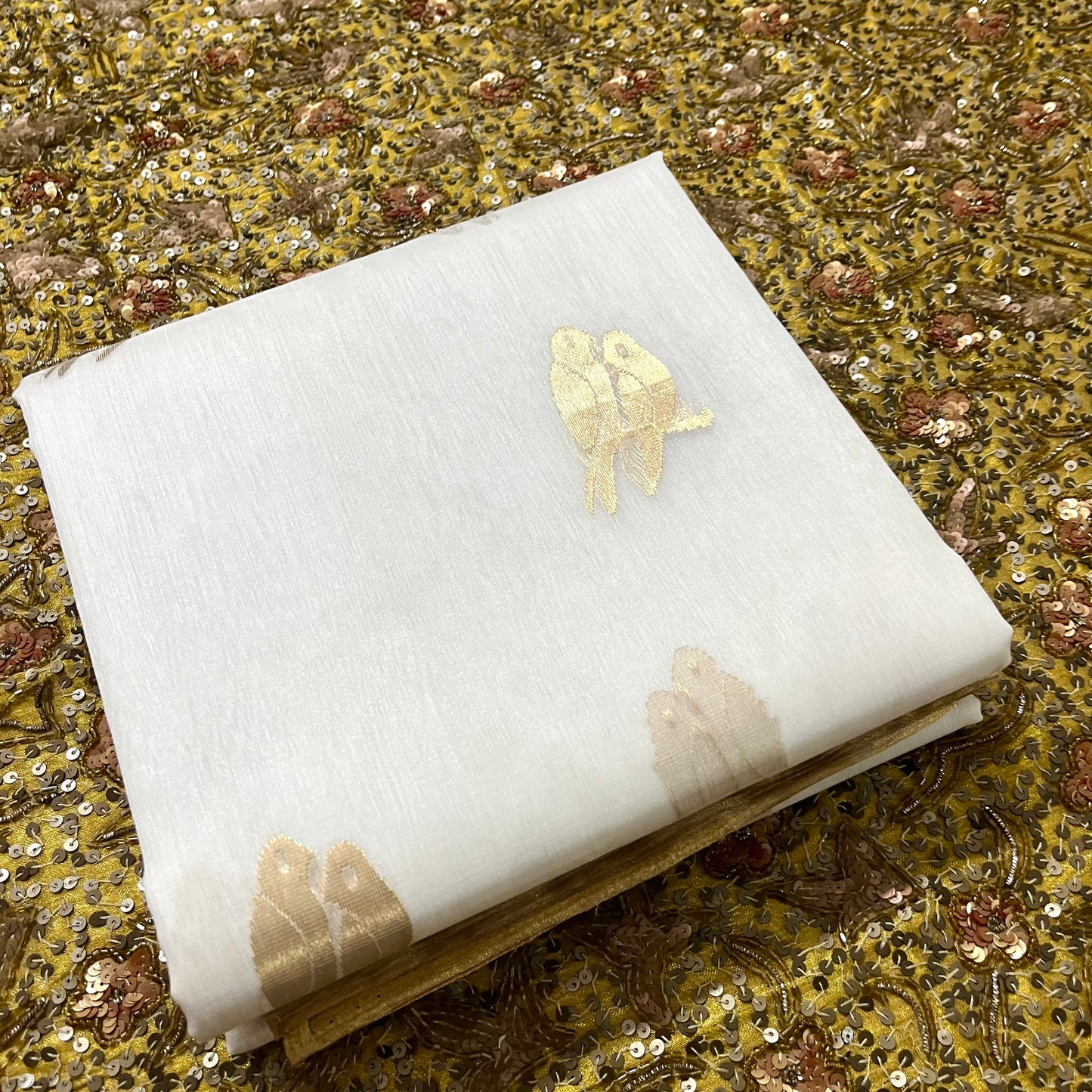 Off white and gold chanderi organza silk saree with bird motifs all over