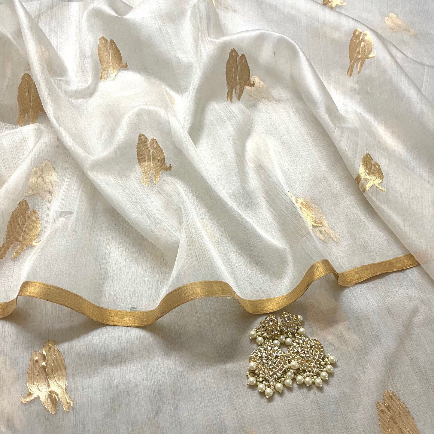 Off white and gold chanderi organza silk saree with bird motifs all over