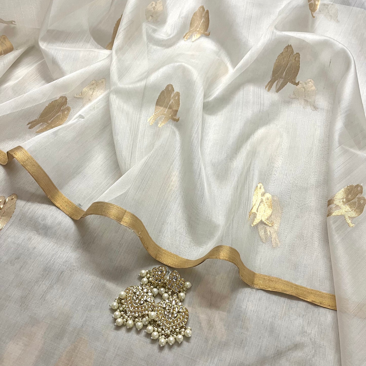 Off white and gold chanderi organza silk saree with bird motifs all over