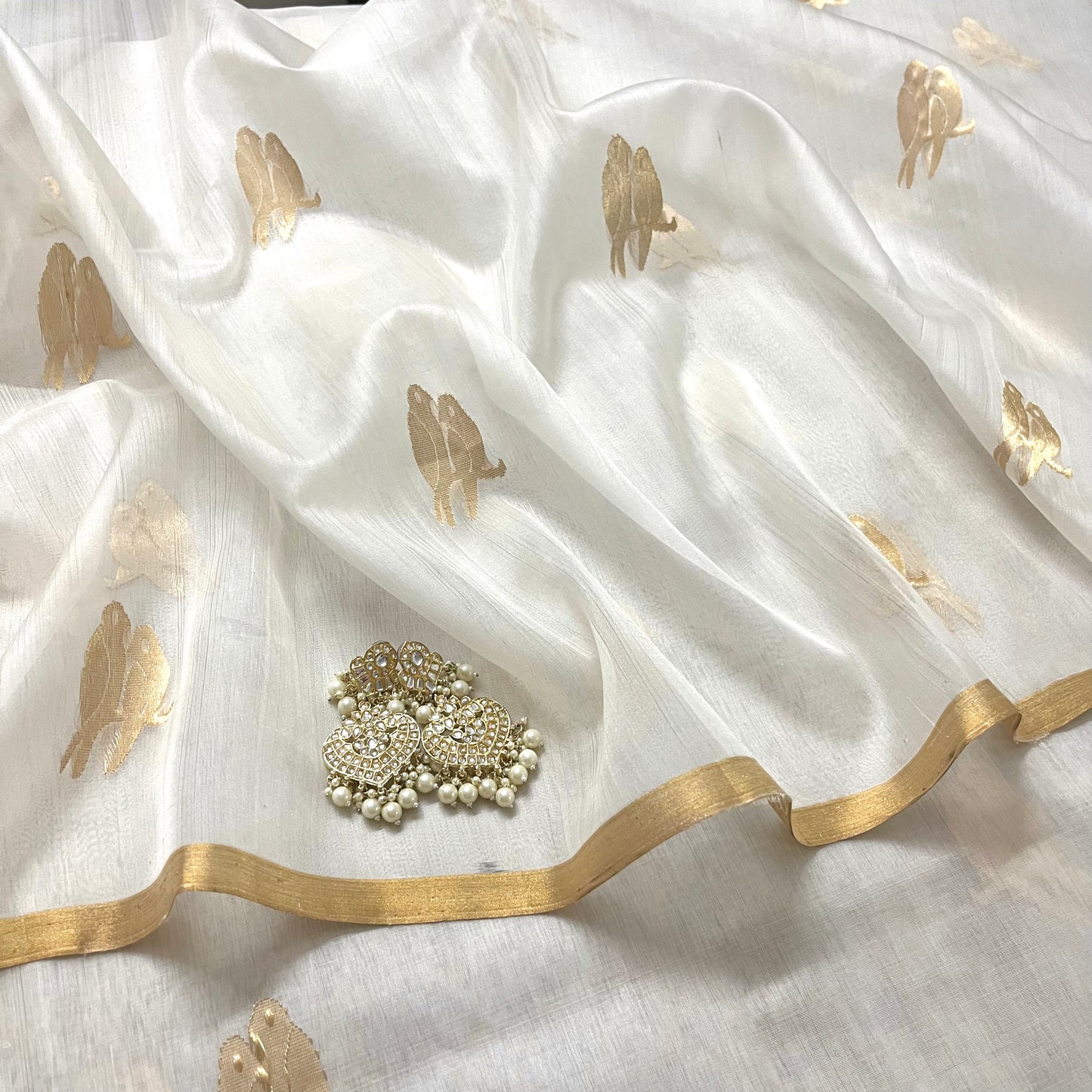 Off white and gold chanderi organza silk saree with bird motifs all over