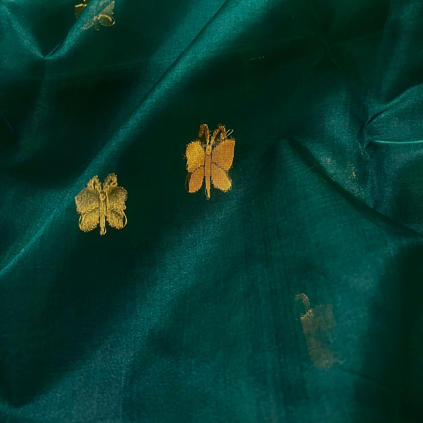 Teal green chanderi silk saree with butterfly motifs all over