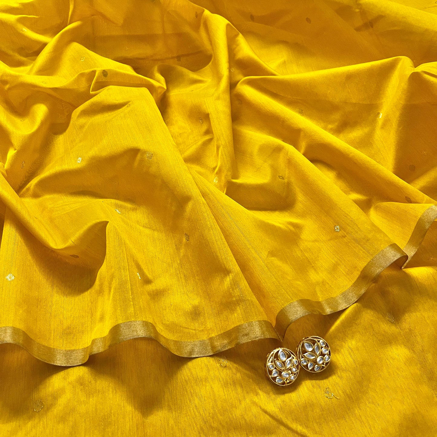 Yellow chanderi saree with zari bootis all over
