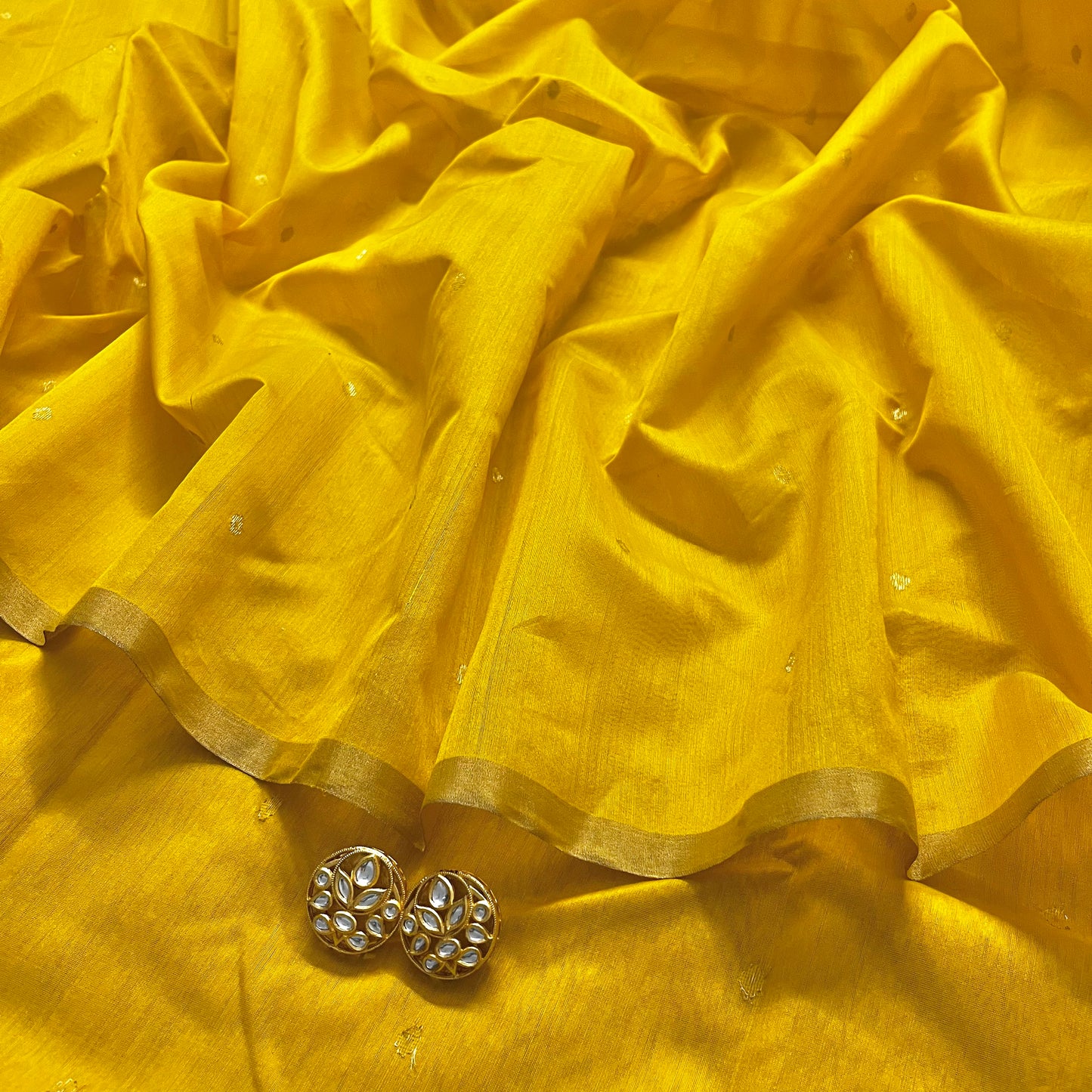Yellow chanderi saree with zari bootis all over
