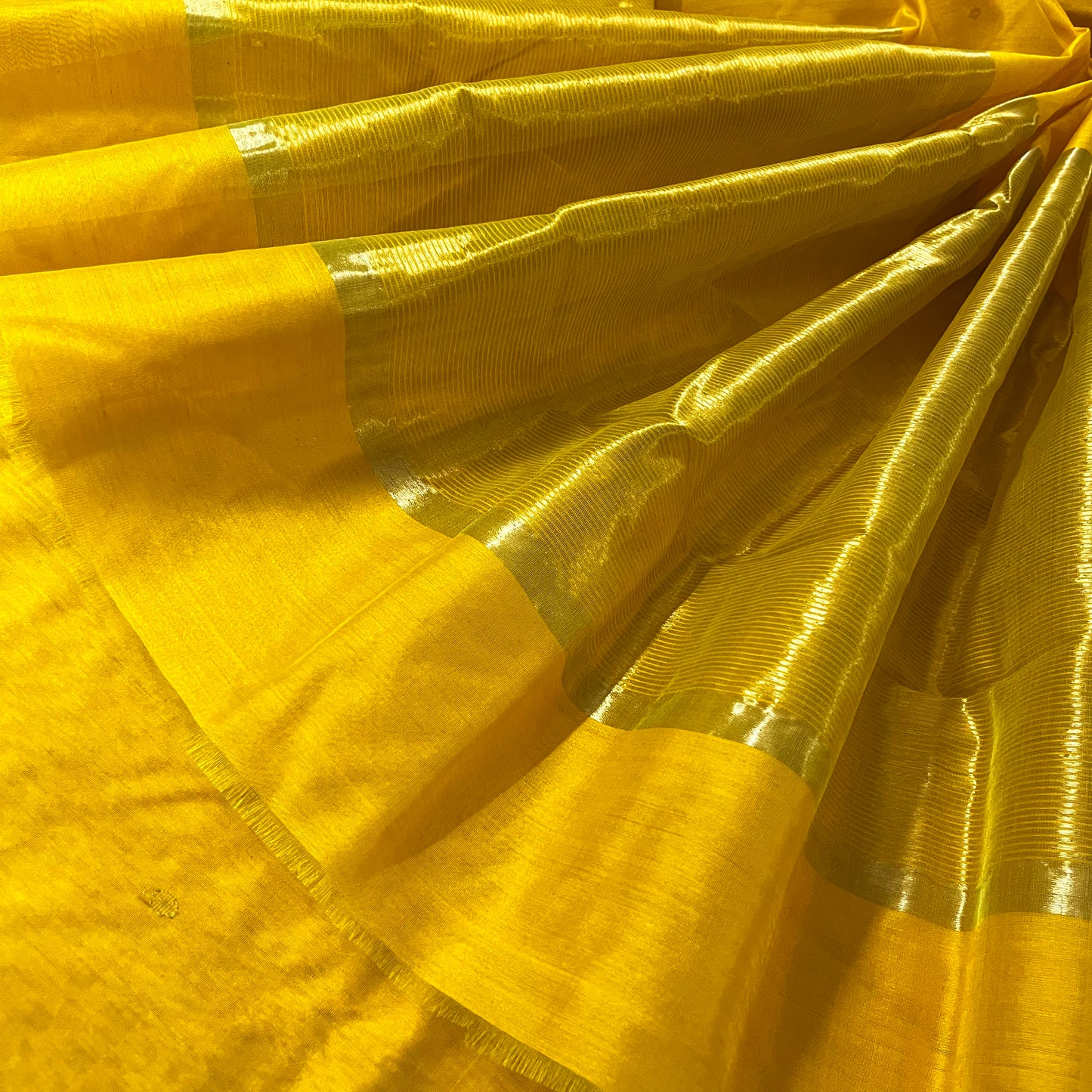 Yellow chanderi saree with zari bootis all over