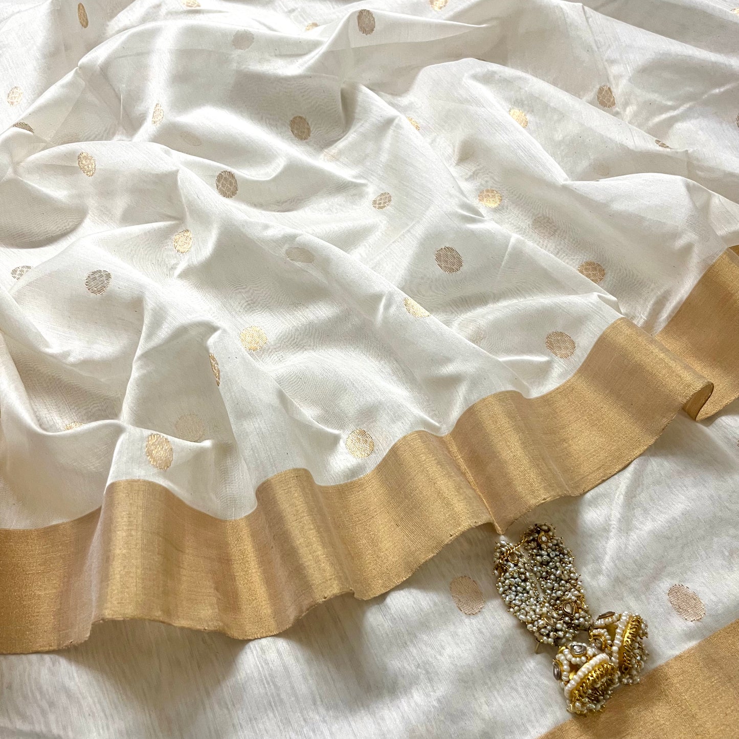 Off white chanderi saree with zari bootis all over