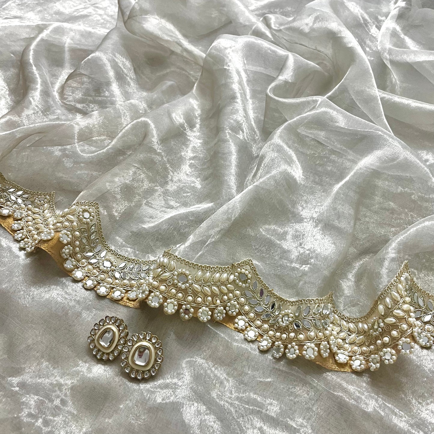 Molten silver chanderi tissue silk saree with pearl and mirror work border