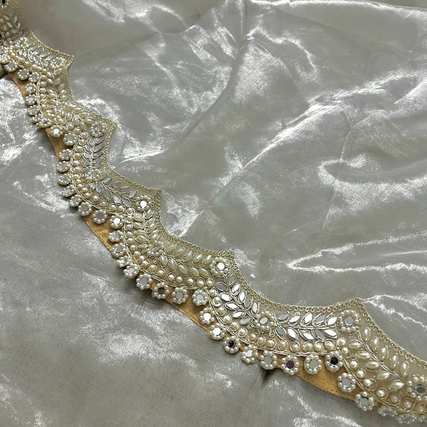 Molten silver chanderi tissue silk saree with pearl and mirror work border