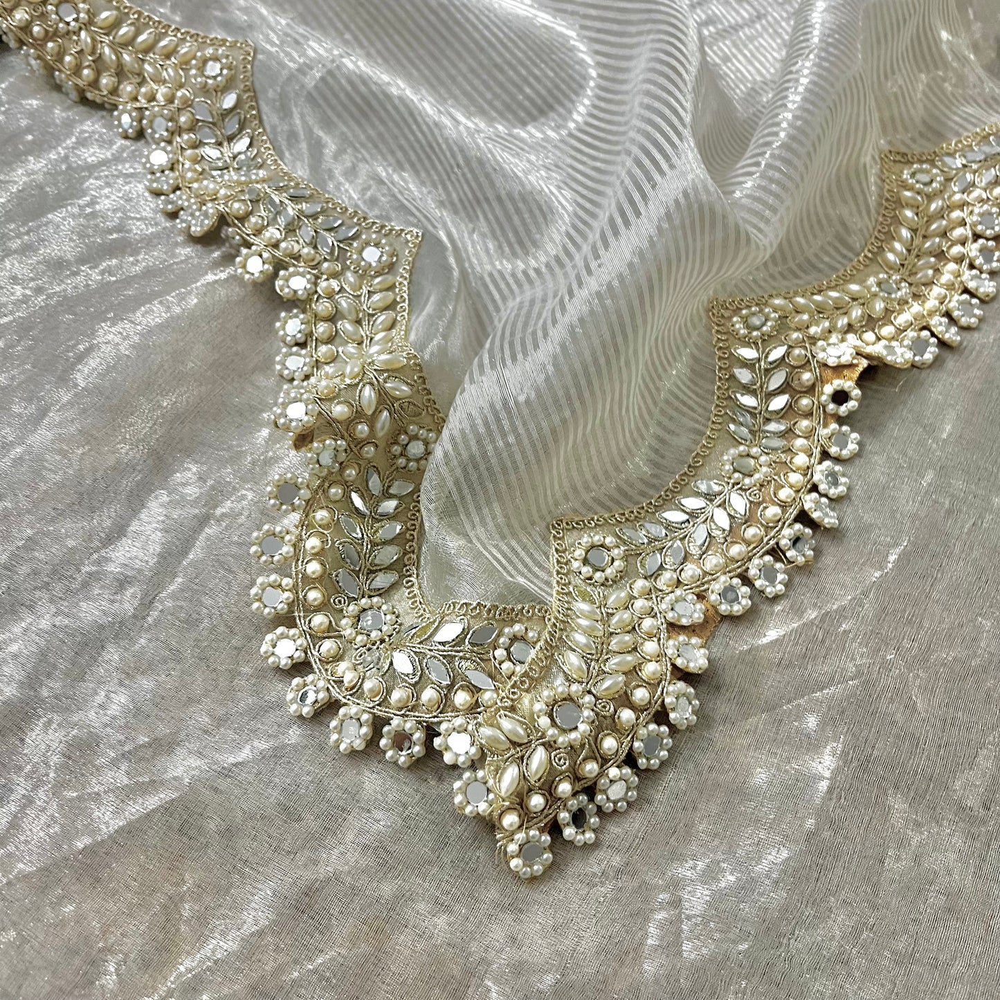 Molten silver chanderi tissue silk saree with pearl and mirror work border