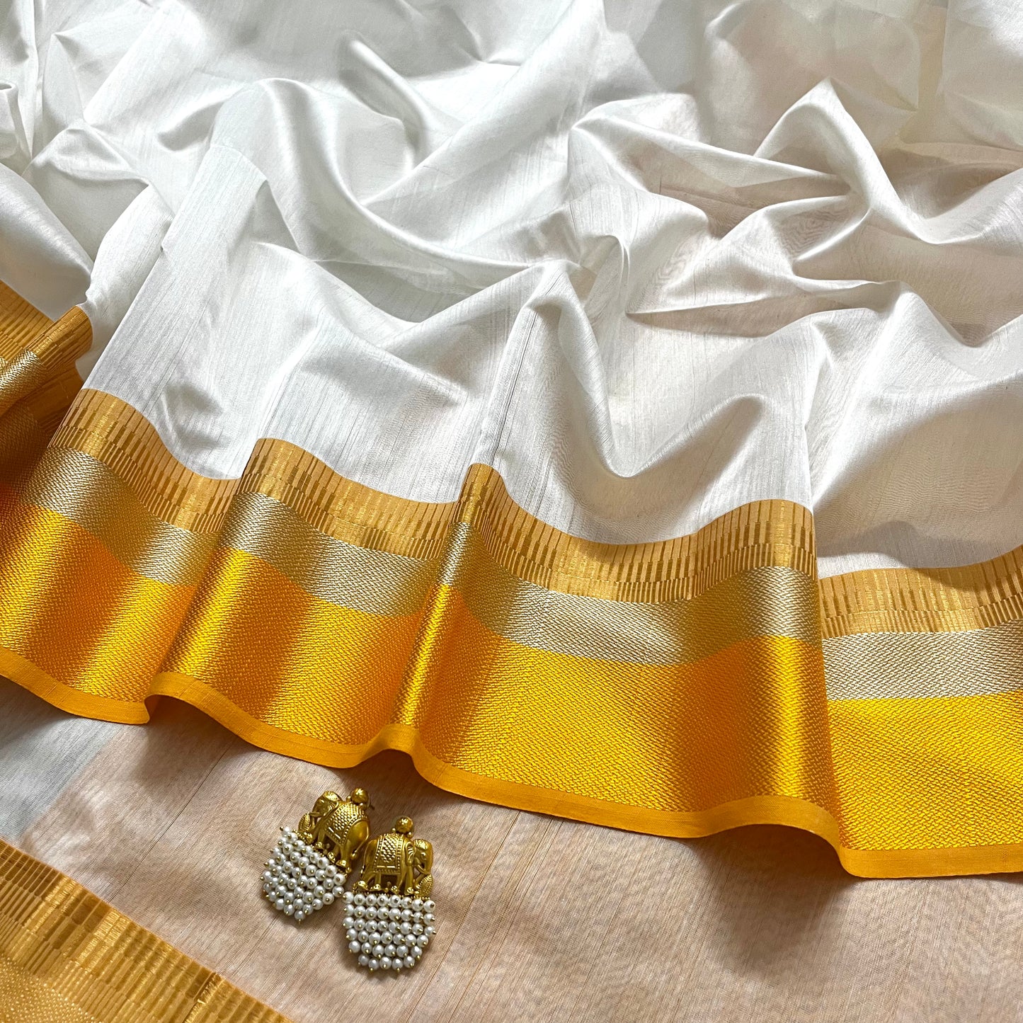 White and yellow maheshwari saree with resham border