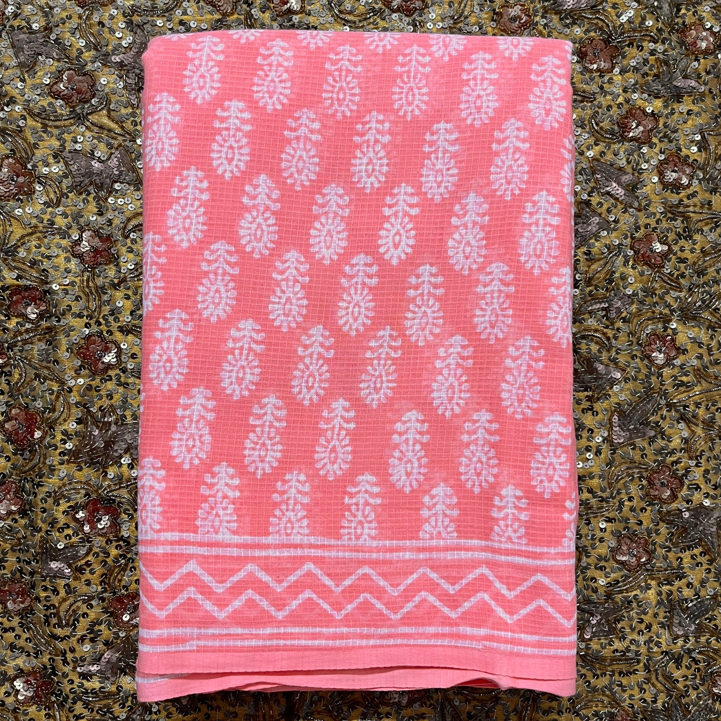 Peachish pink kota checks saree with block print all over