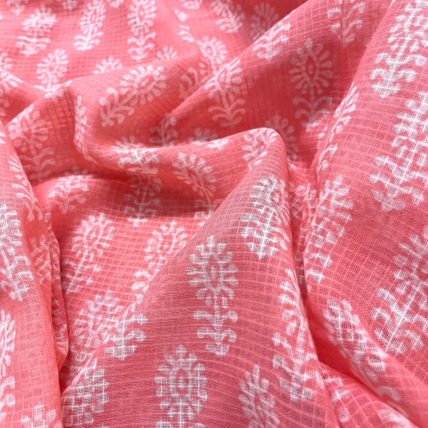 Peachish pink kota checks saree with block print all over