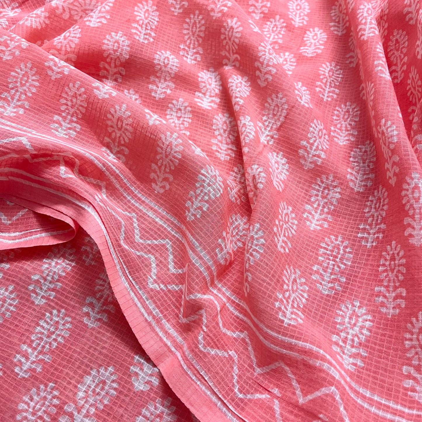 Peachish pink kota checks saree with block print all over