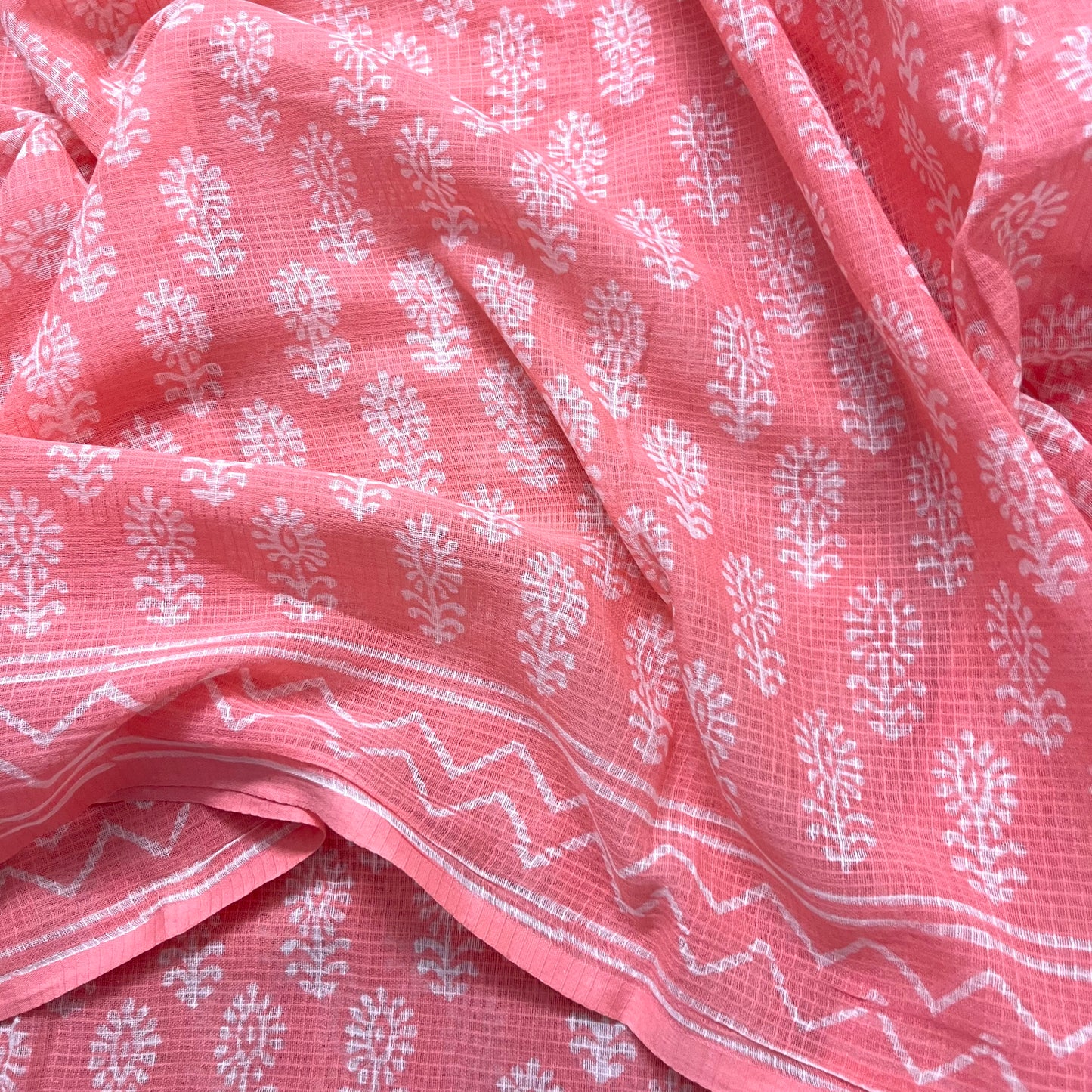 Peachish pink kota checks saree with block print all over