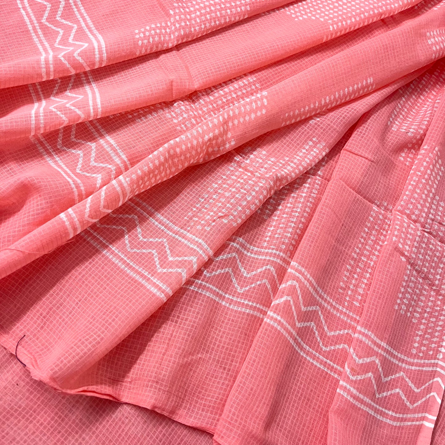 Peachish pink kota checks saree with block print all over