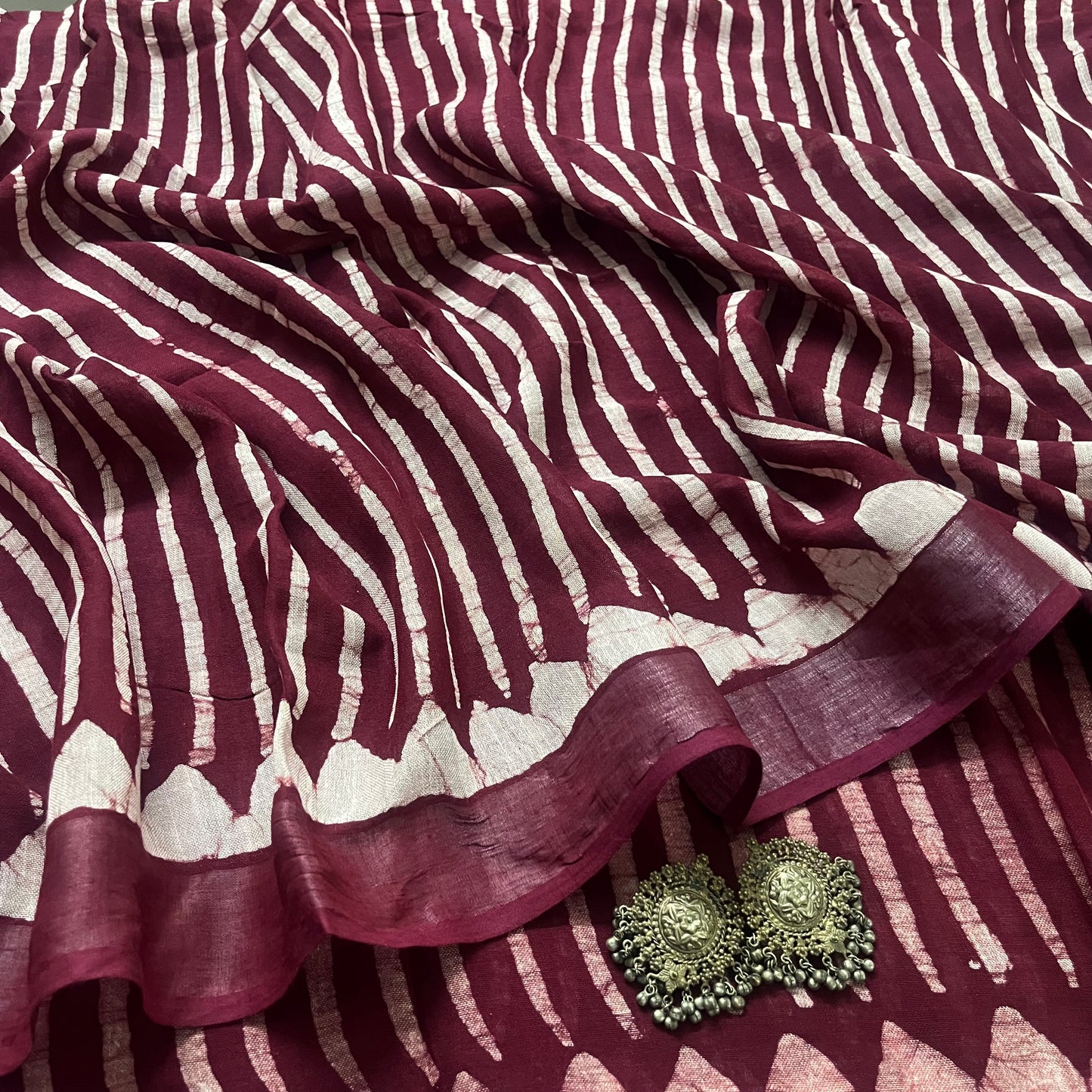 Dark maroon linen saree with block print all over