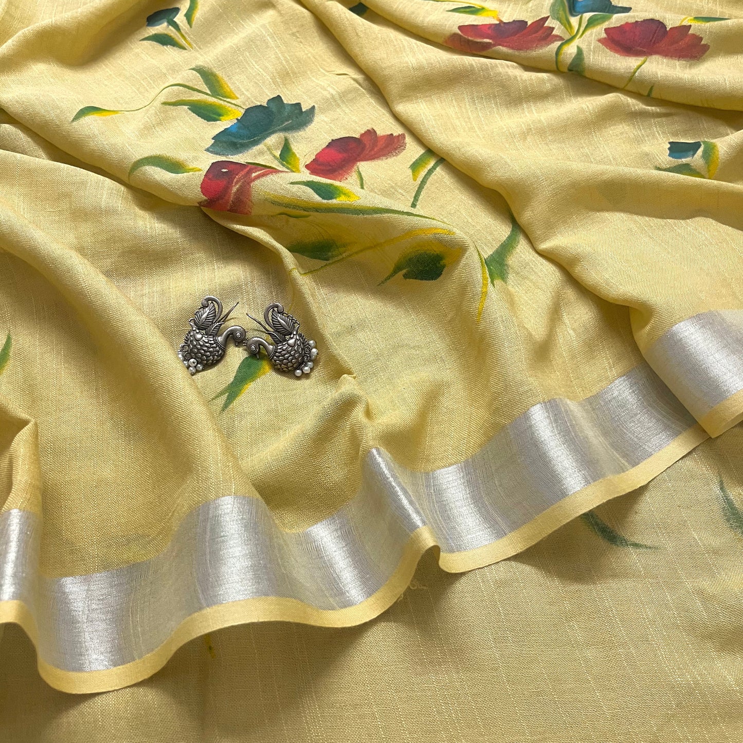 Corn yellow linen saree with hand painten flowers all over