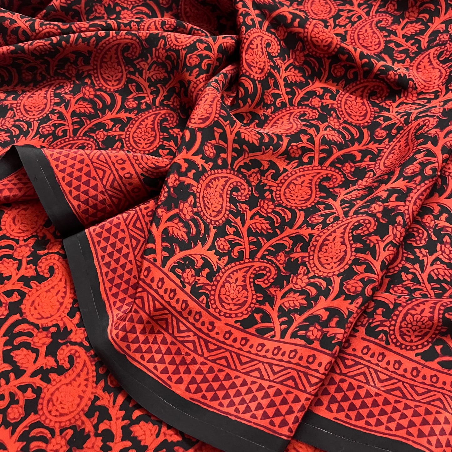 Rust and black bagh print saree