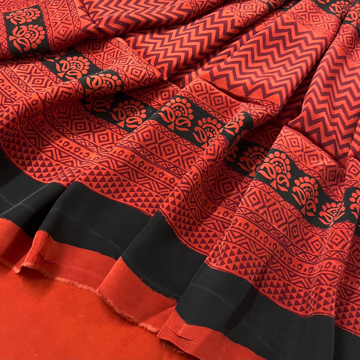Rust and black bagh print saree