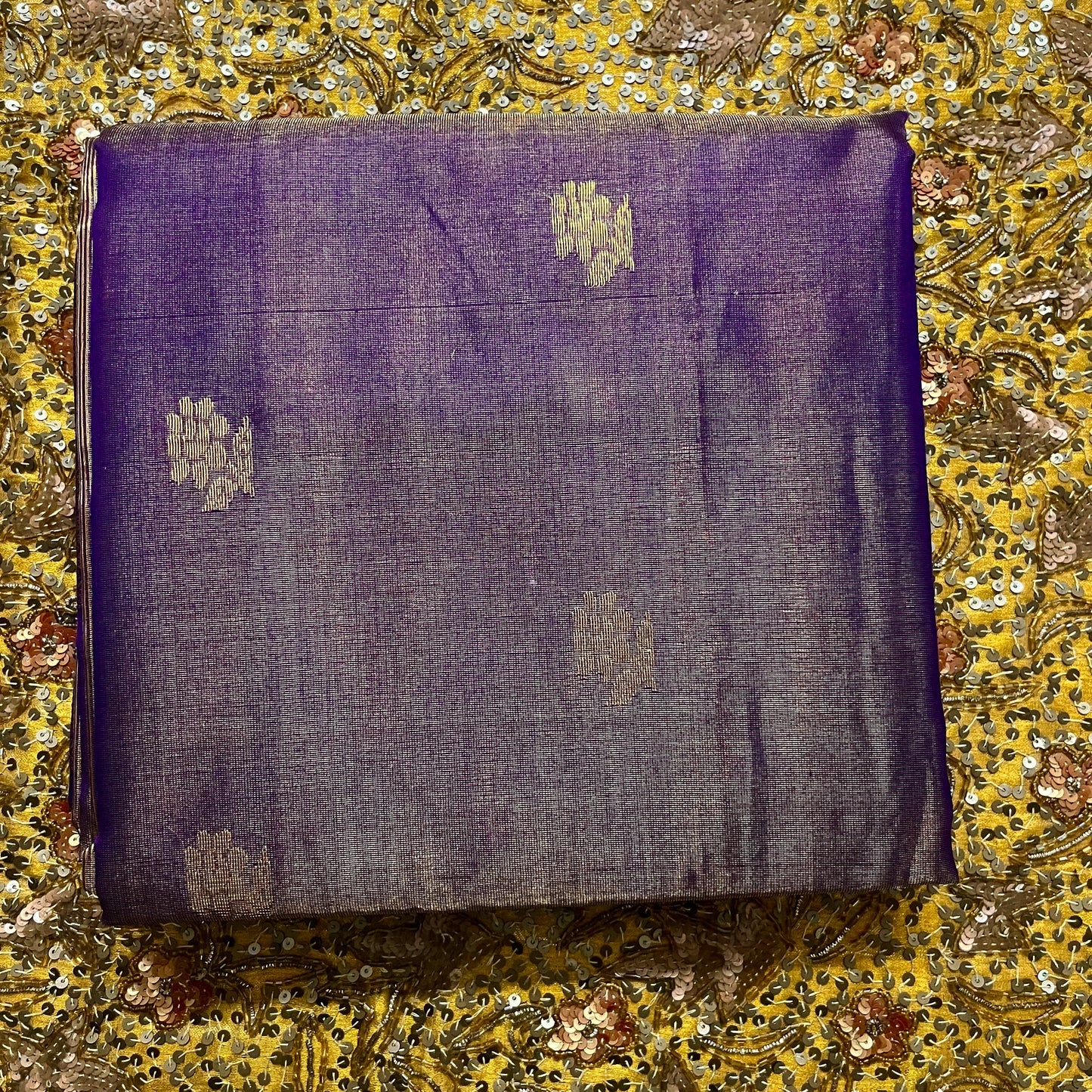 Dark purple maheshwari tissue silk saree with flower motifs all over