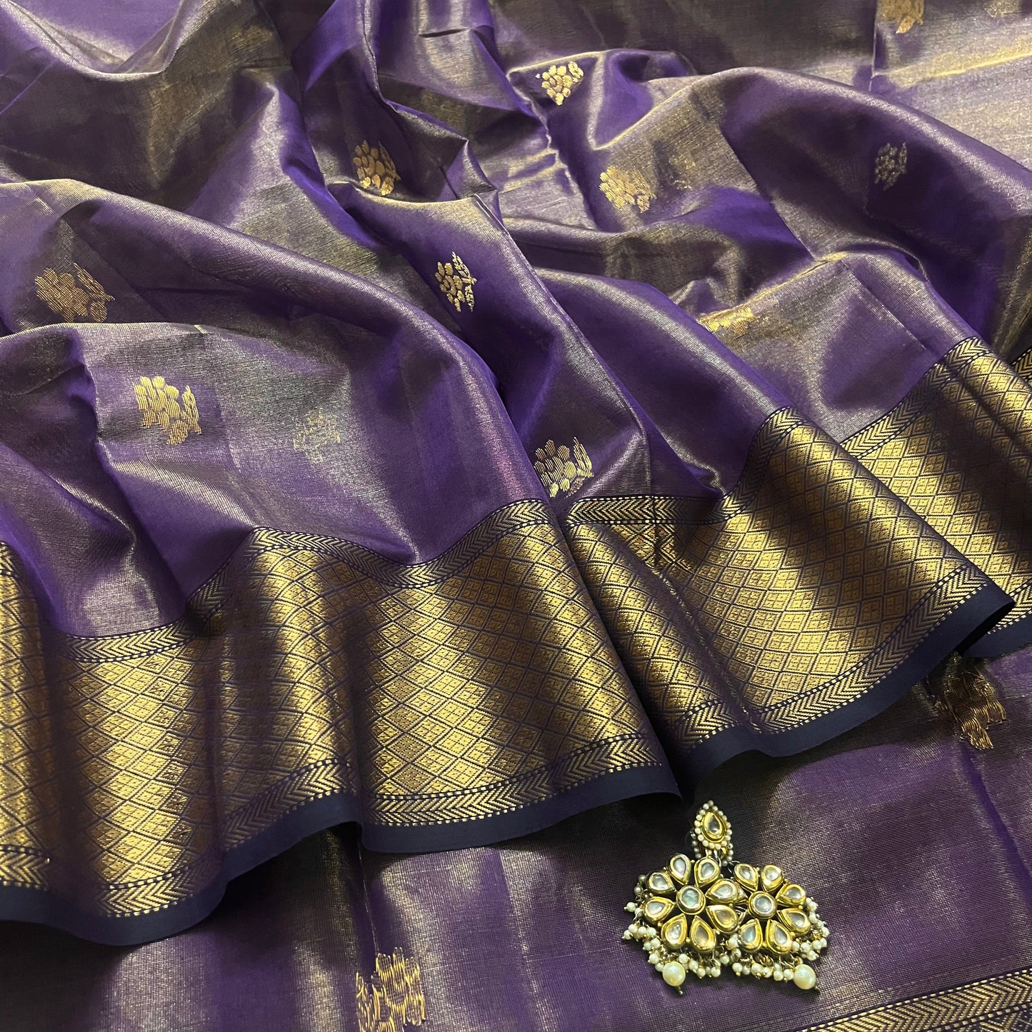 Dark purple maheshwari tissue silk saree with flower motifs all over