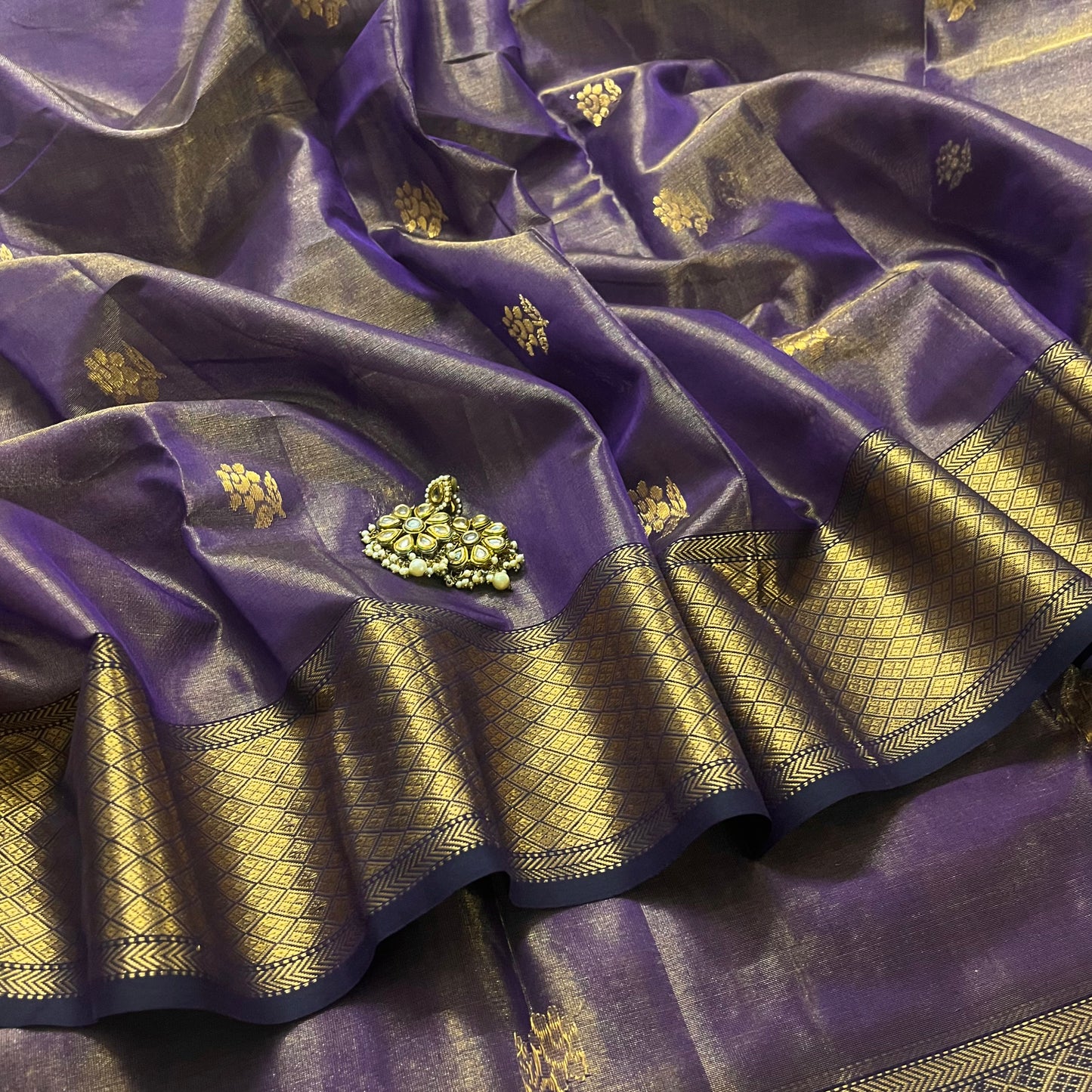 Dark purple maheshwari tissue silk saree with flower motifs all over