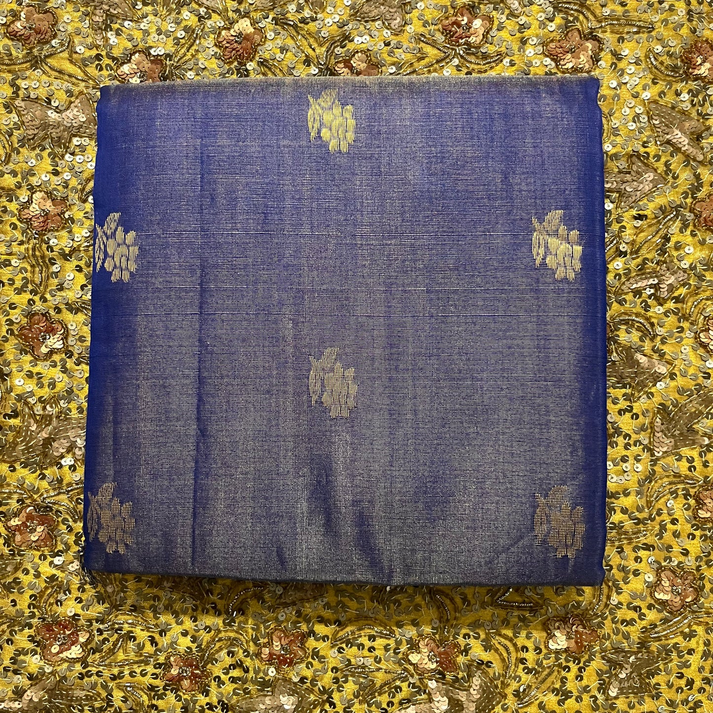 Dark blue maheshwari tissue silk saree with flower motifs all over
