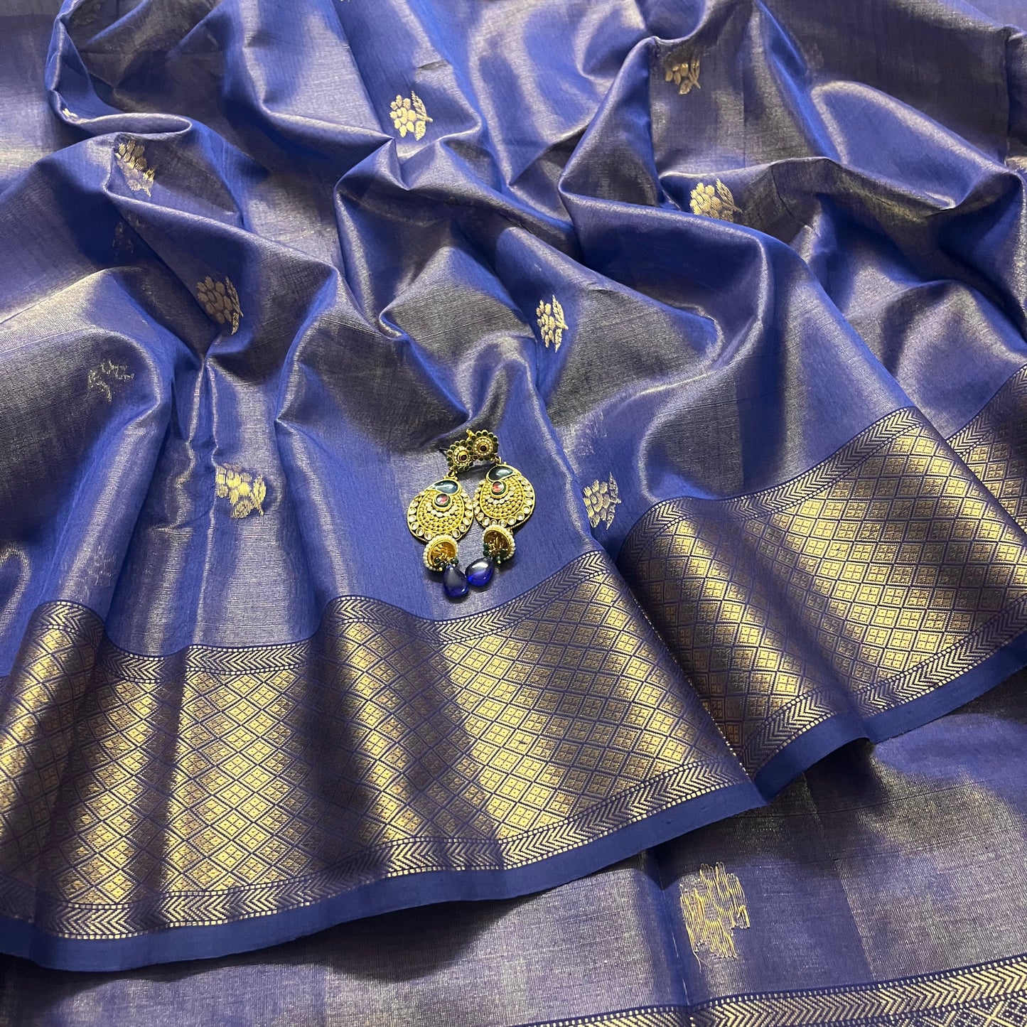 Dark blue maheshwari tissue silk saree with flower motifs all over