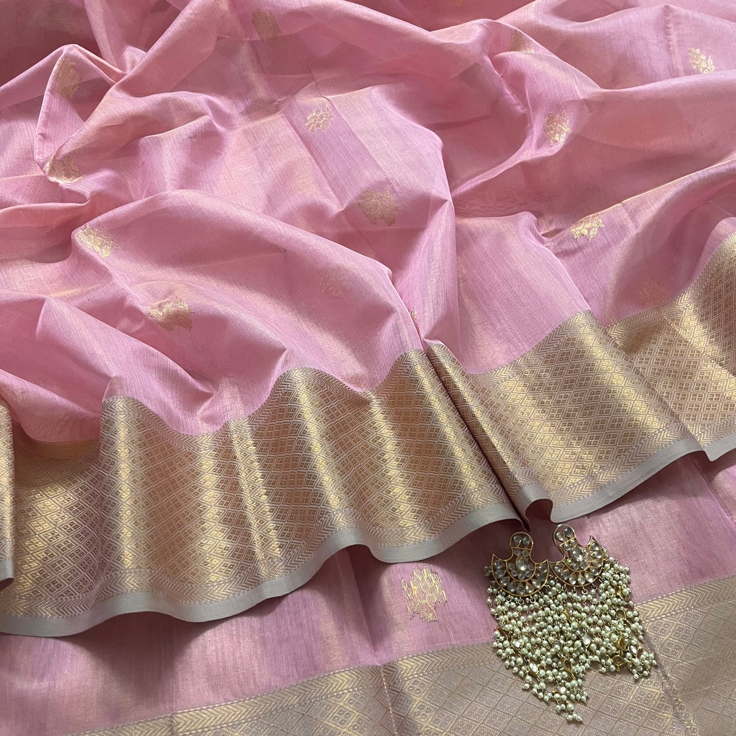 Pink maheshwari tissue silk saree with flower motifs all over