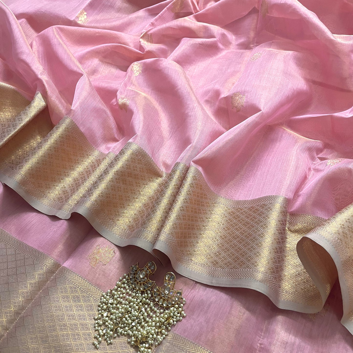 Pink maheshwari tissue silk saree with flower motifs all over