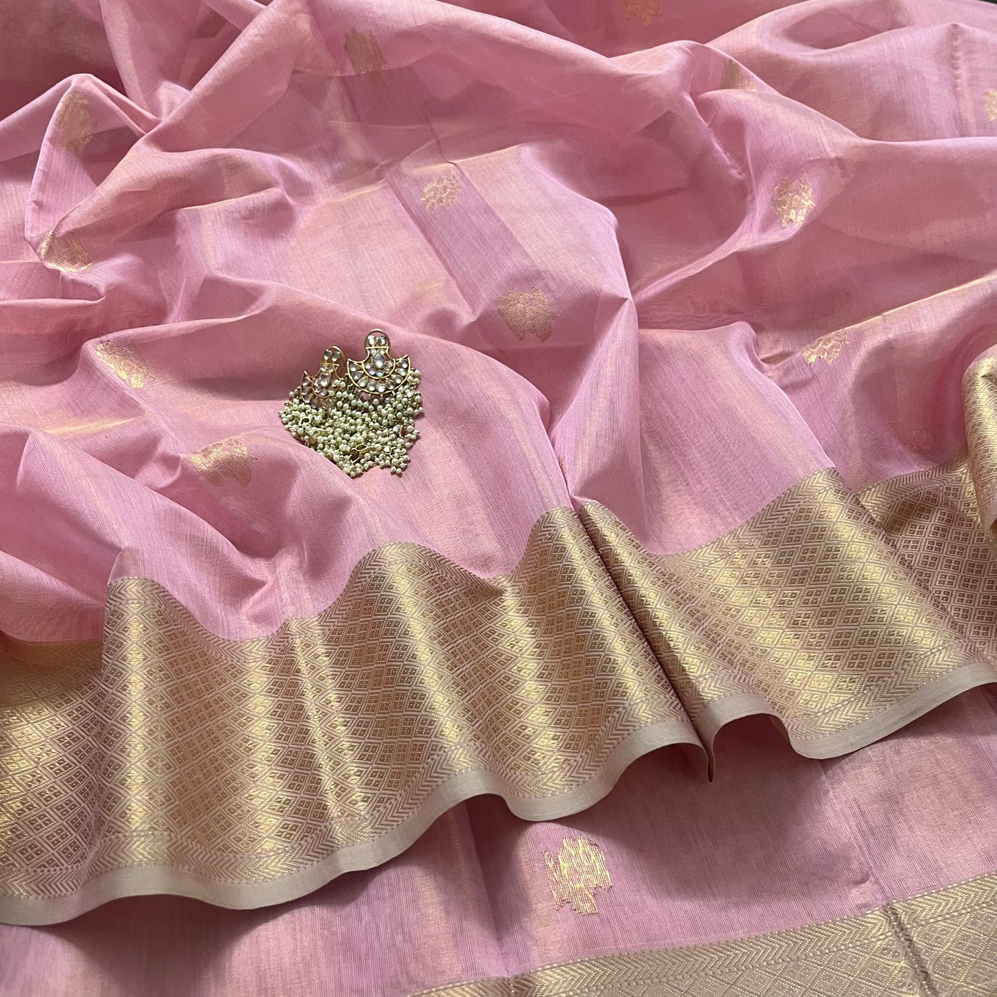 Pink maheshwari tissue silk saree with flower motifs all over