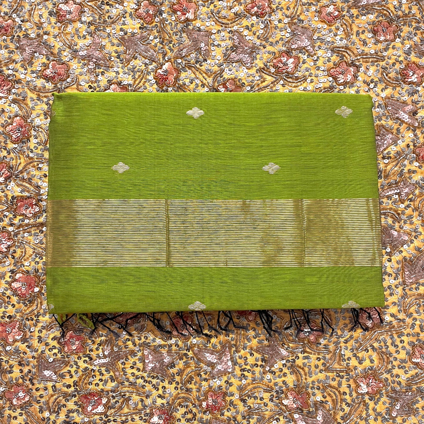 Olive green maheshwari saree with zari bootis all over